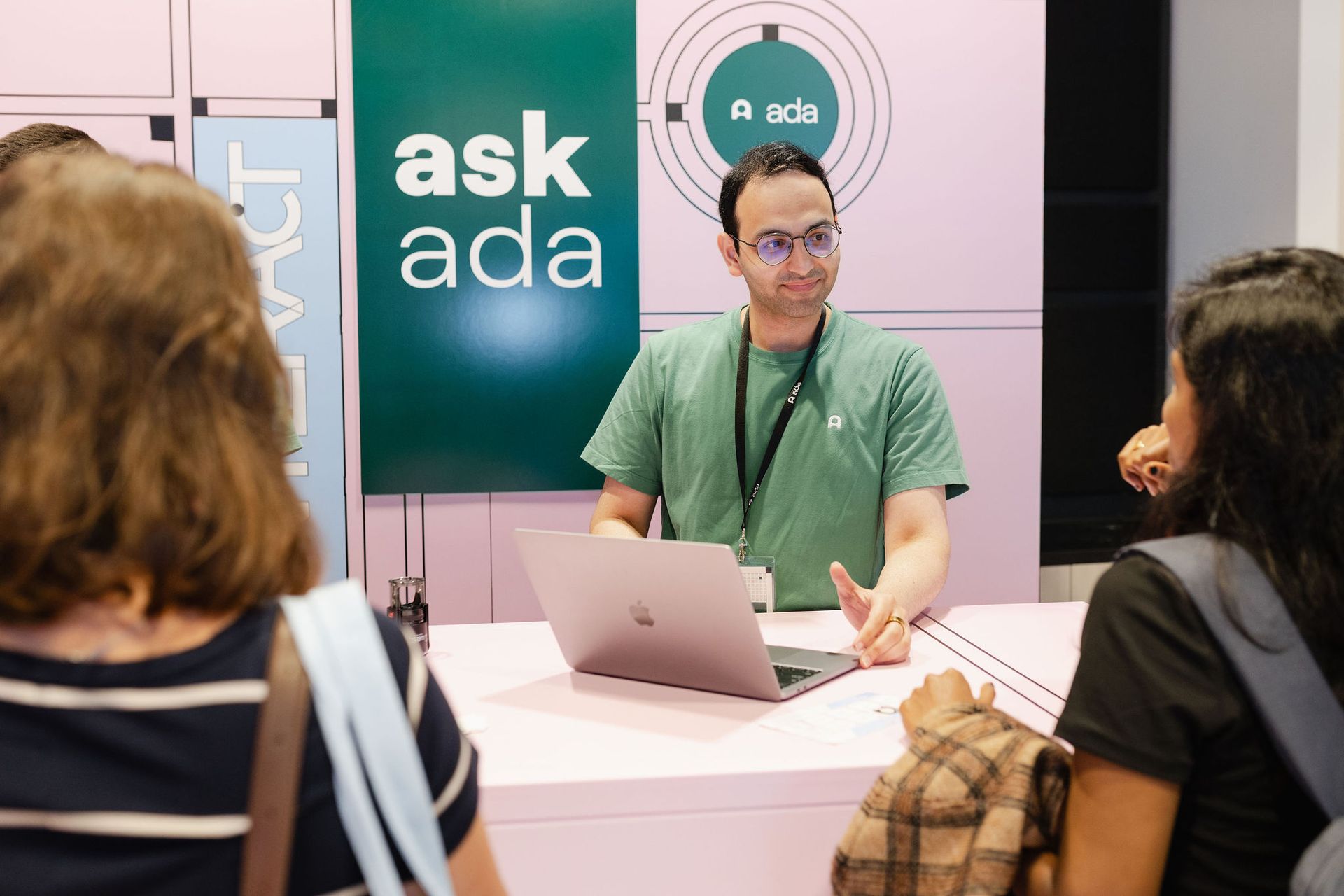 A man in a red suit is giving a speech at the junior opening night awards