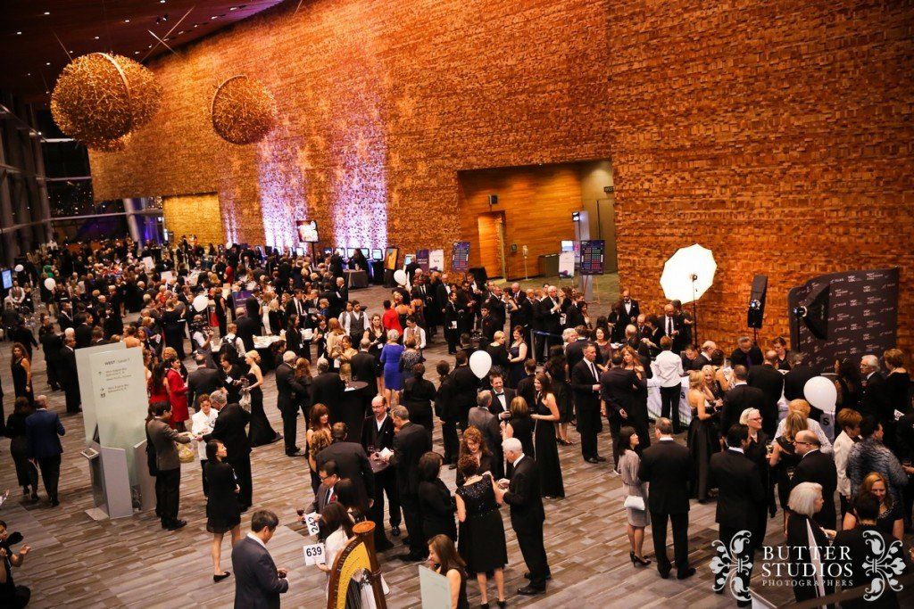 A large group of people are gathered in a large room