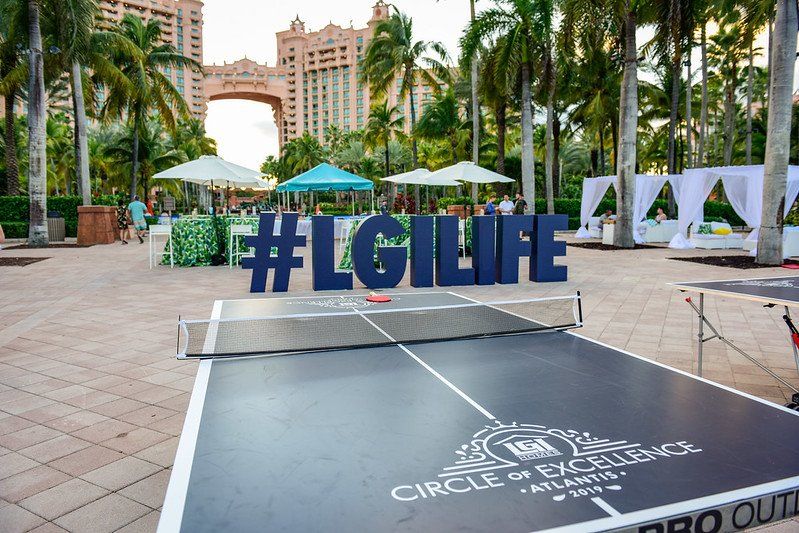 A ping pong table with a sign that says #lglife