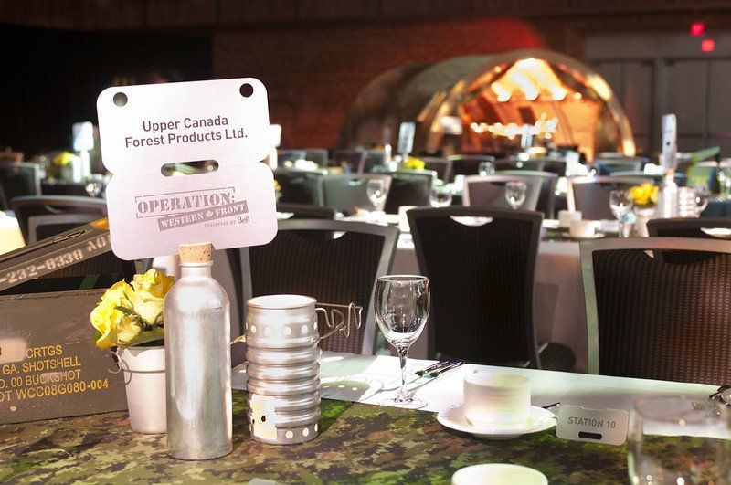 A table with a sign that says upper canada funeral products on it
