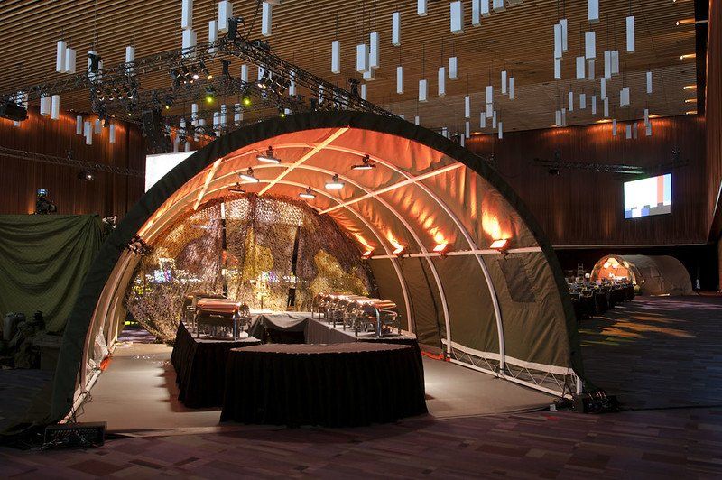 A large room with a tent in the middle of it