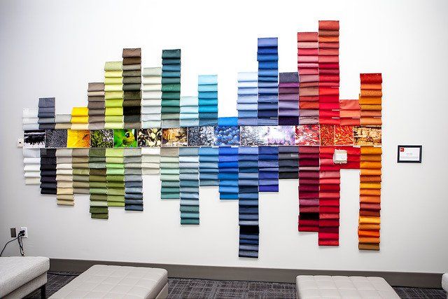 A wall with a rainbow of colors on it