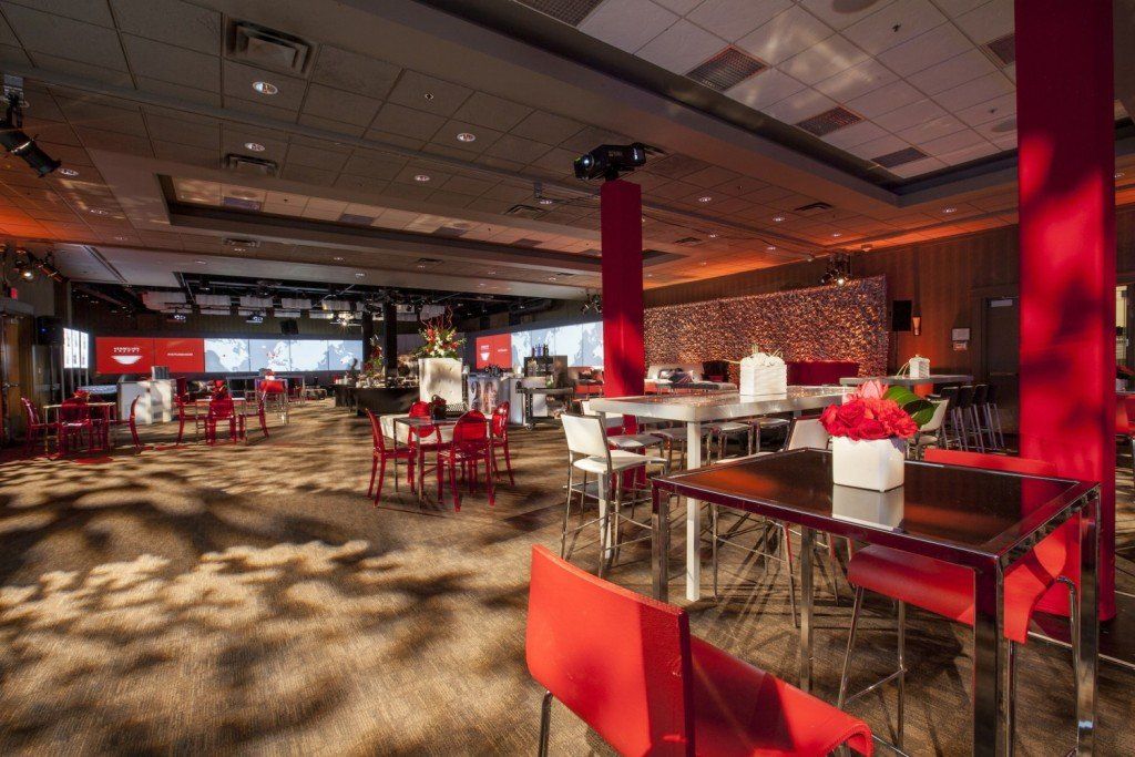 A large room with tables and chairs in it