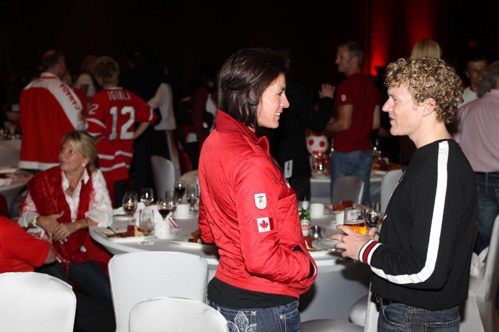 A woman in a red jacket with the number 12 on it