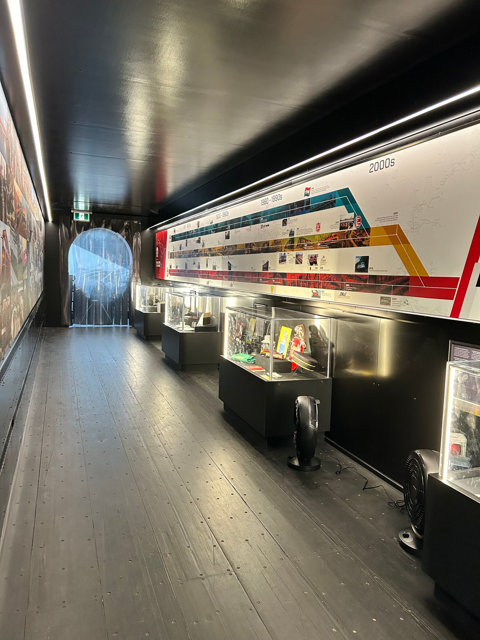 A long hallway with a train painted on the wall.