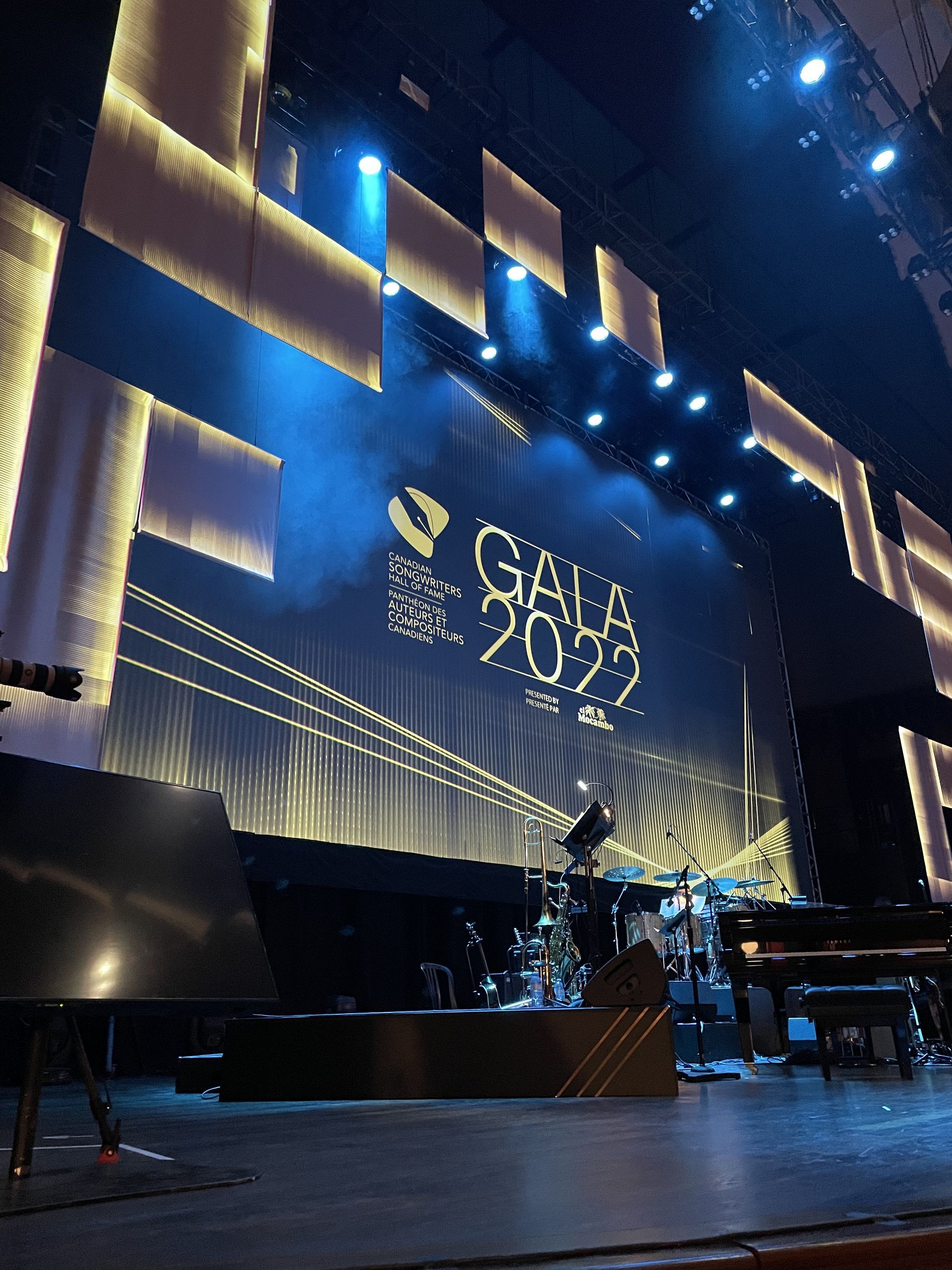 A stage with a large screen that says gala 2022