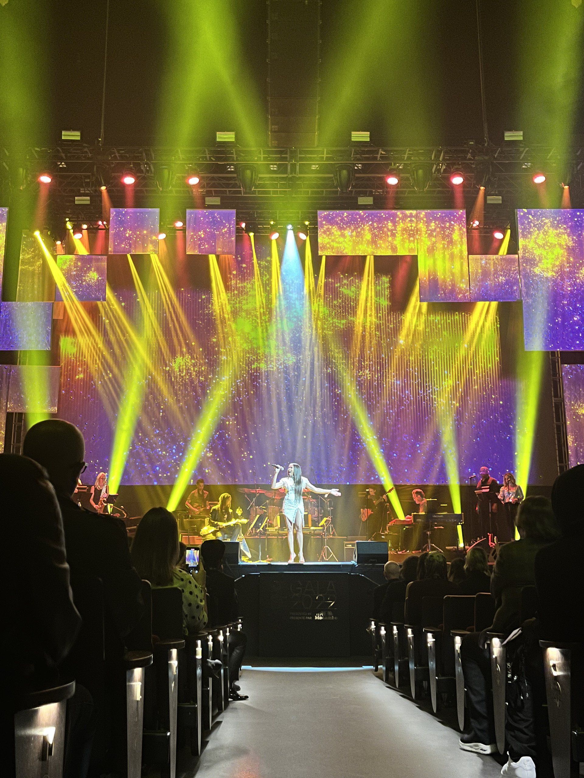 A stage with a lot of lights and a person on it
