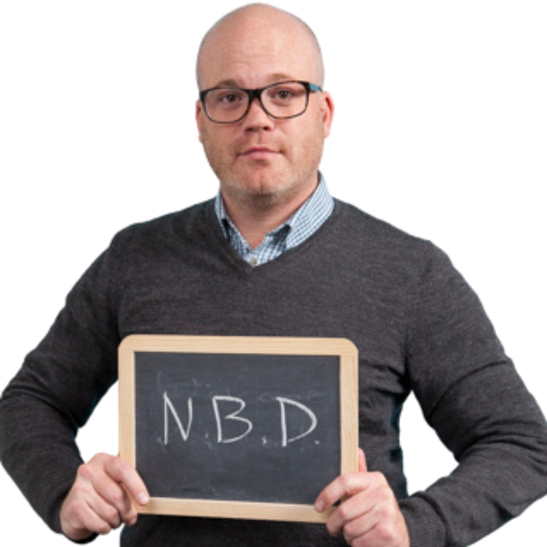 A man is holding a chalkboard with the word nbd written on it