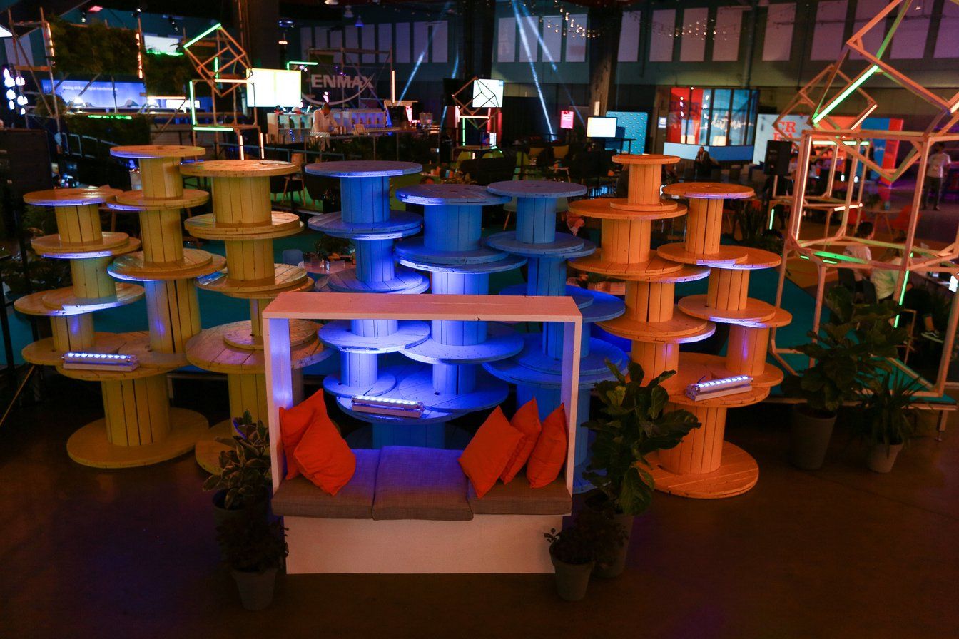 A bunch of wooden spools are stacked on top of each other