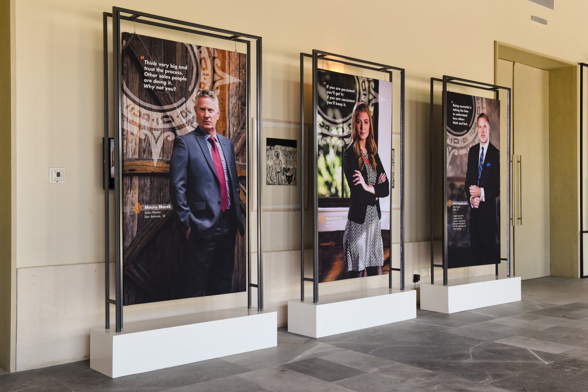 A man in a suit and tie is standing next to a woman in a dress.