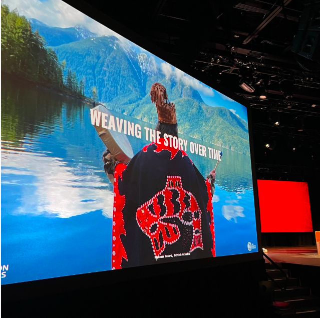 A large screen says weaving the story over time