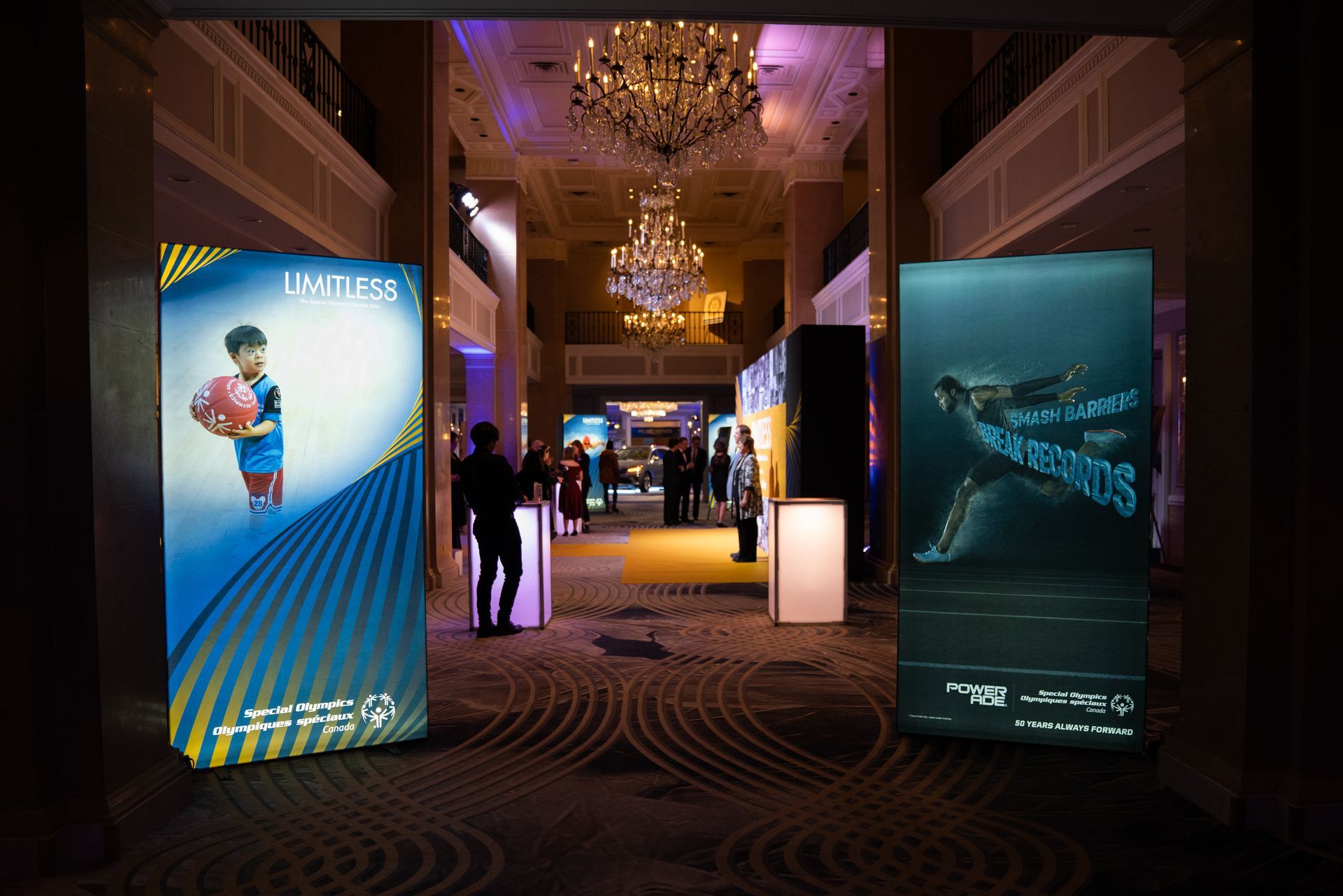 A hallway with a lot of posters on the wall