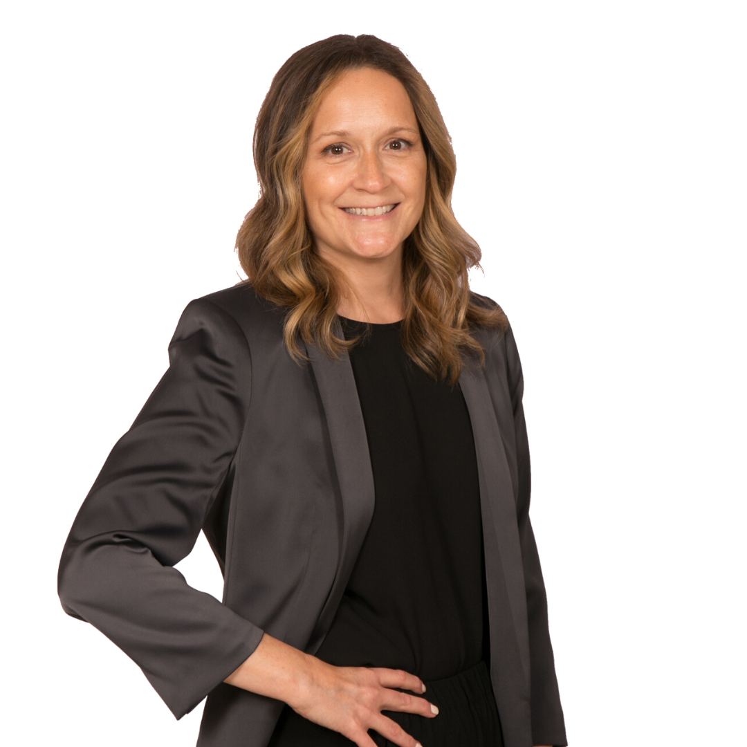 A woman wearing a black shirt and a grey jacket is smiling