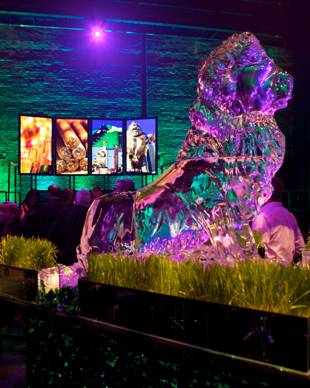 A large ice sculpture of a lion in a dark room
