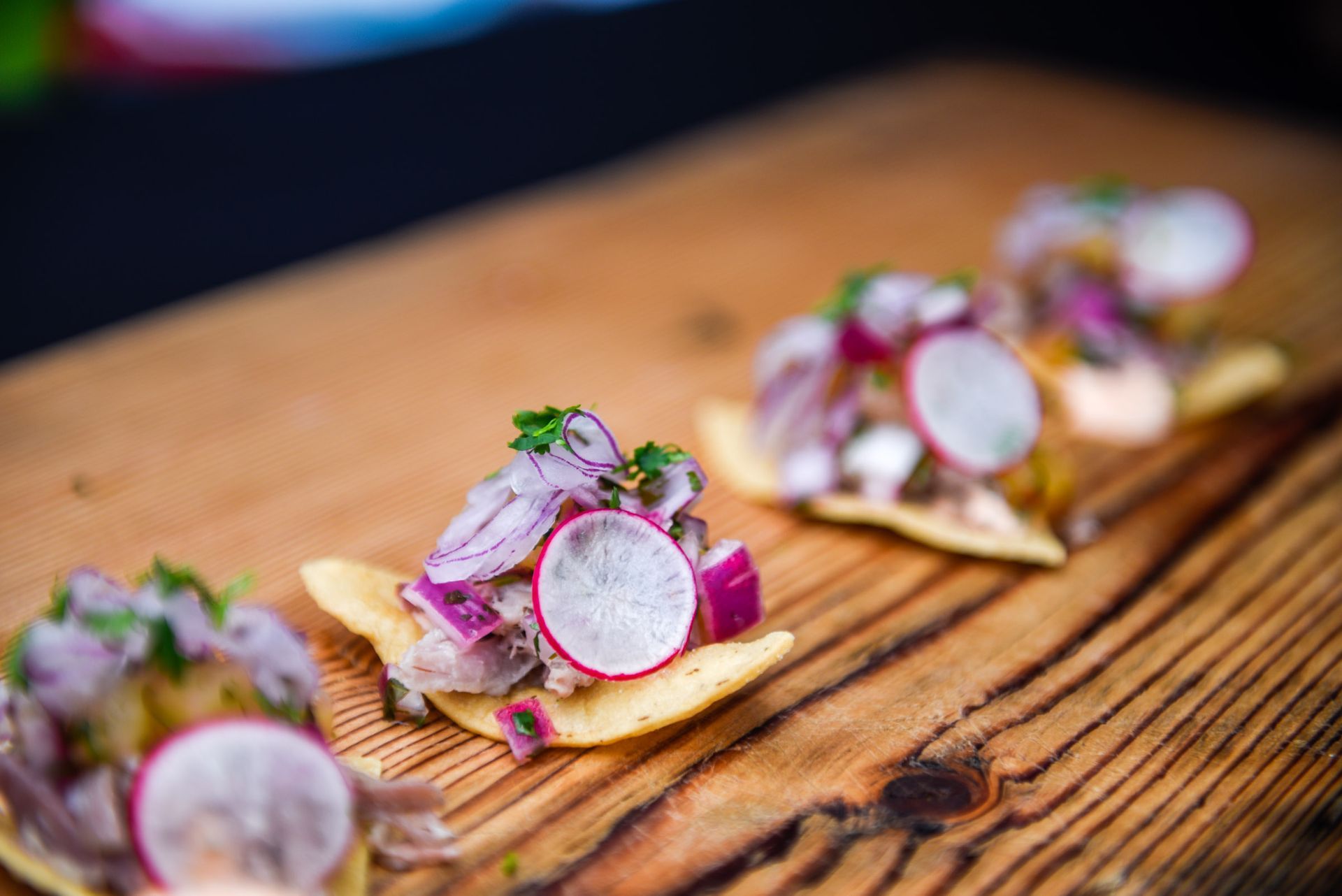 A close up of food on a wooden cutting board.