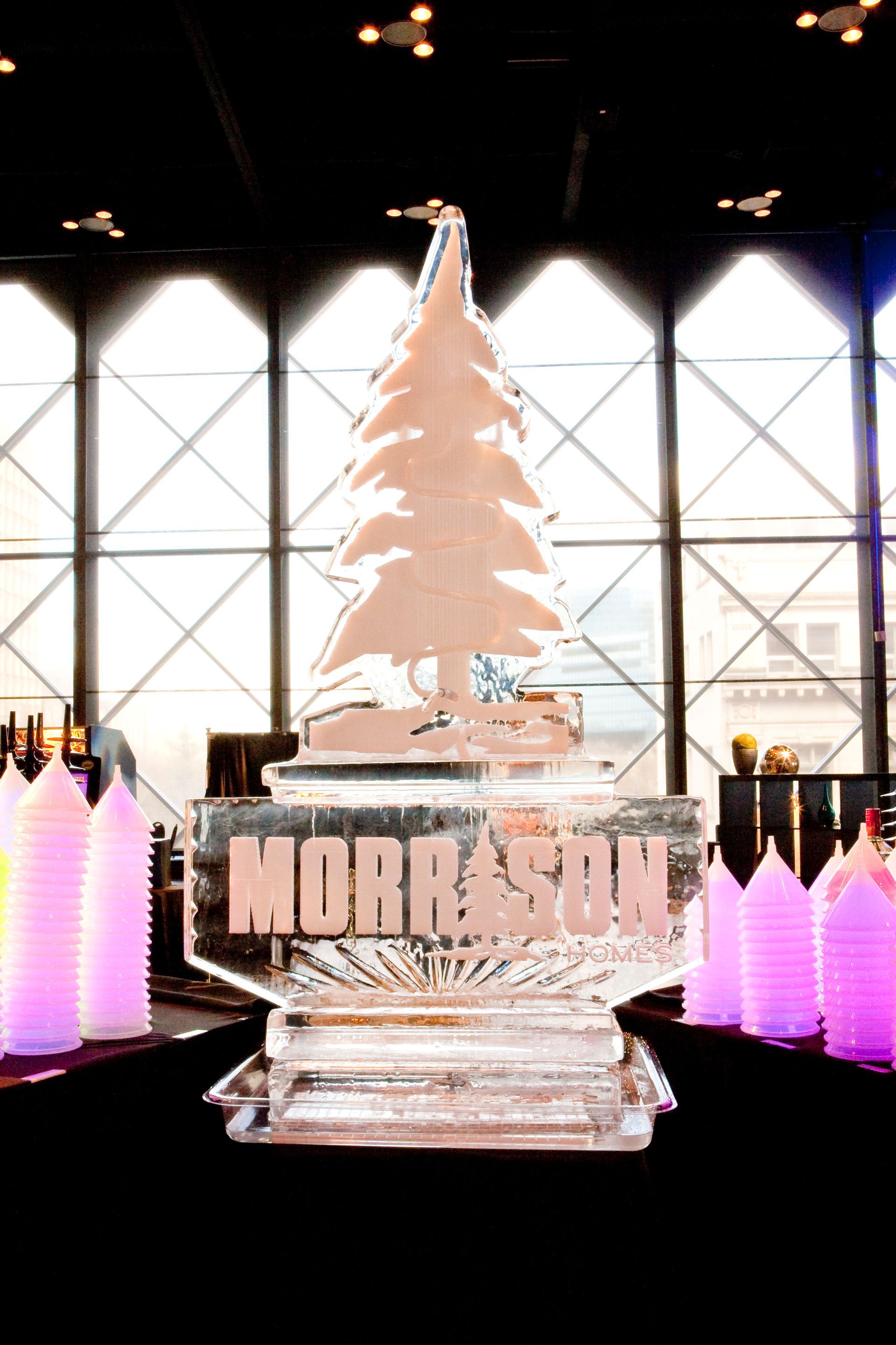 A large ice sculpture of a christmas tree with the name morrison on it