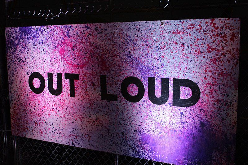 A sign that says out loud on it