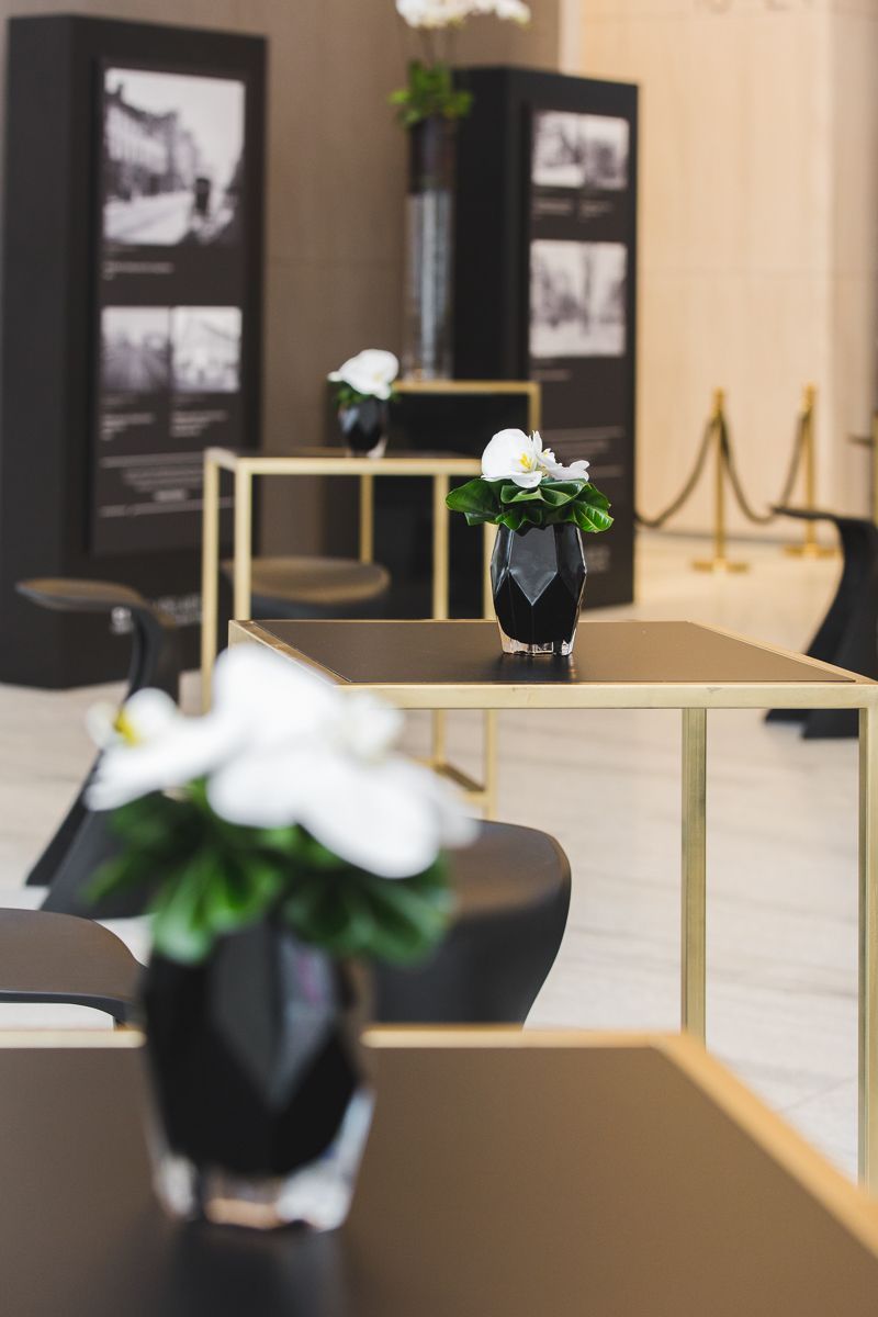 A table with a vase of flowers on it