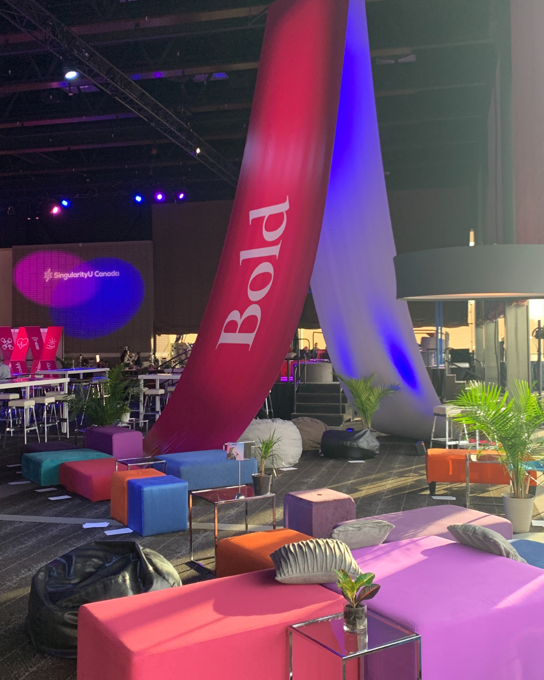 A room with a large red banner that says bold on it