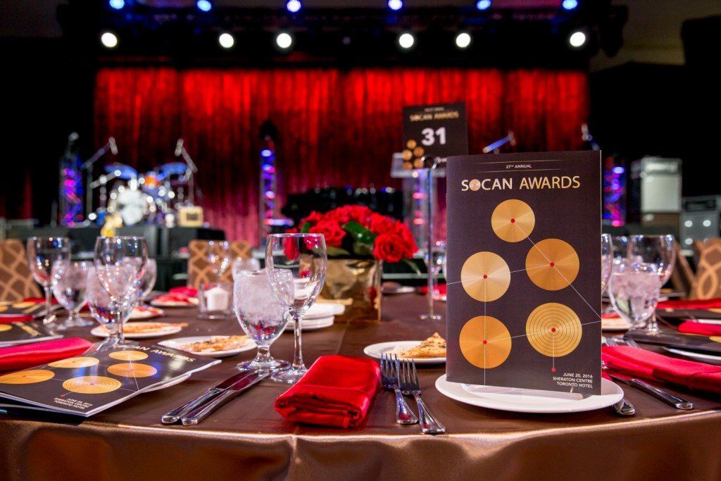 A table set for a dinner party with a menu on it.