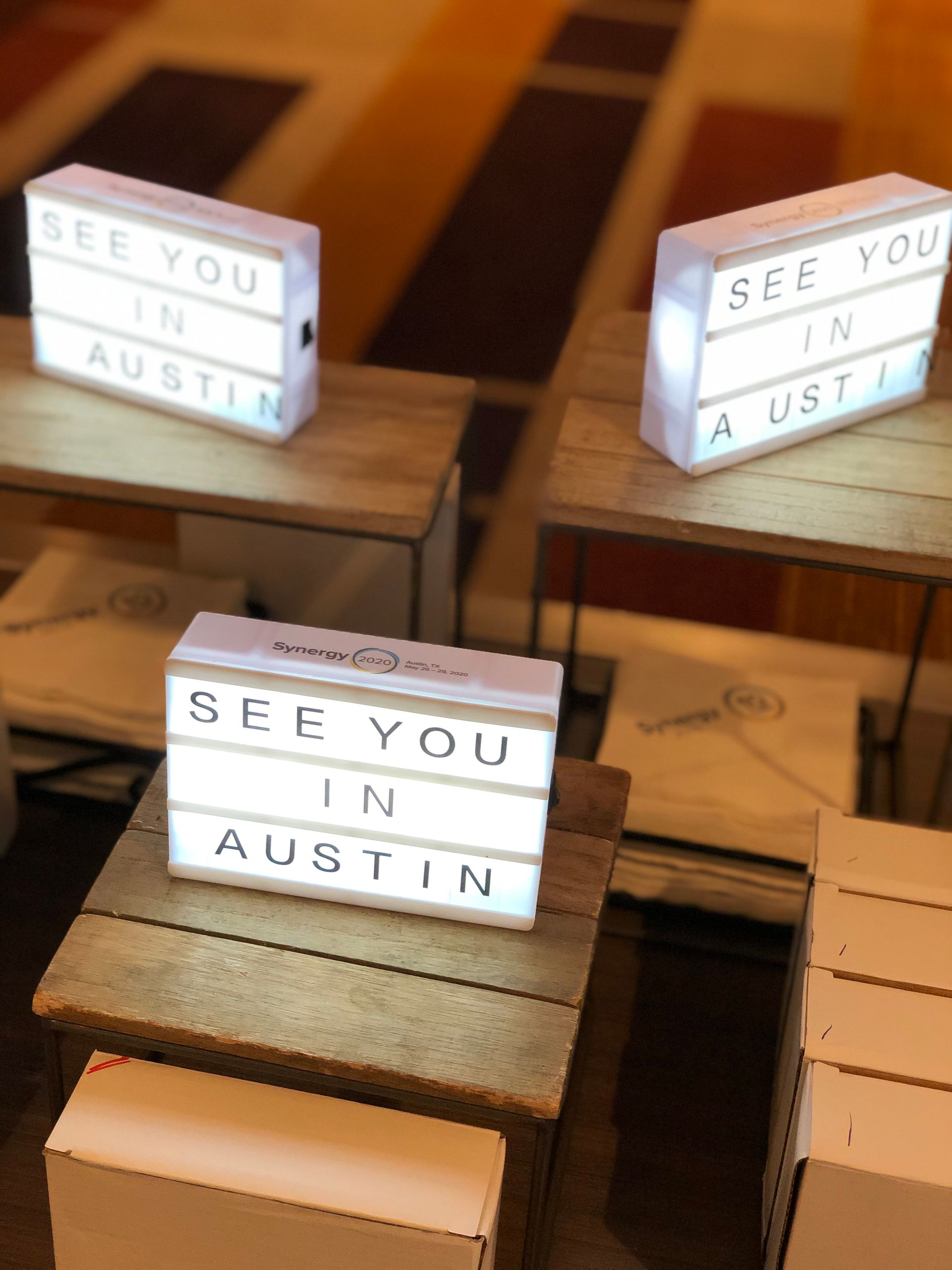 A table with a sign that says see you in austin