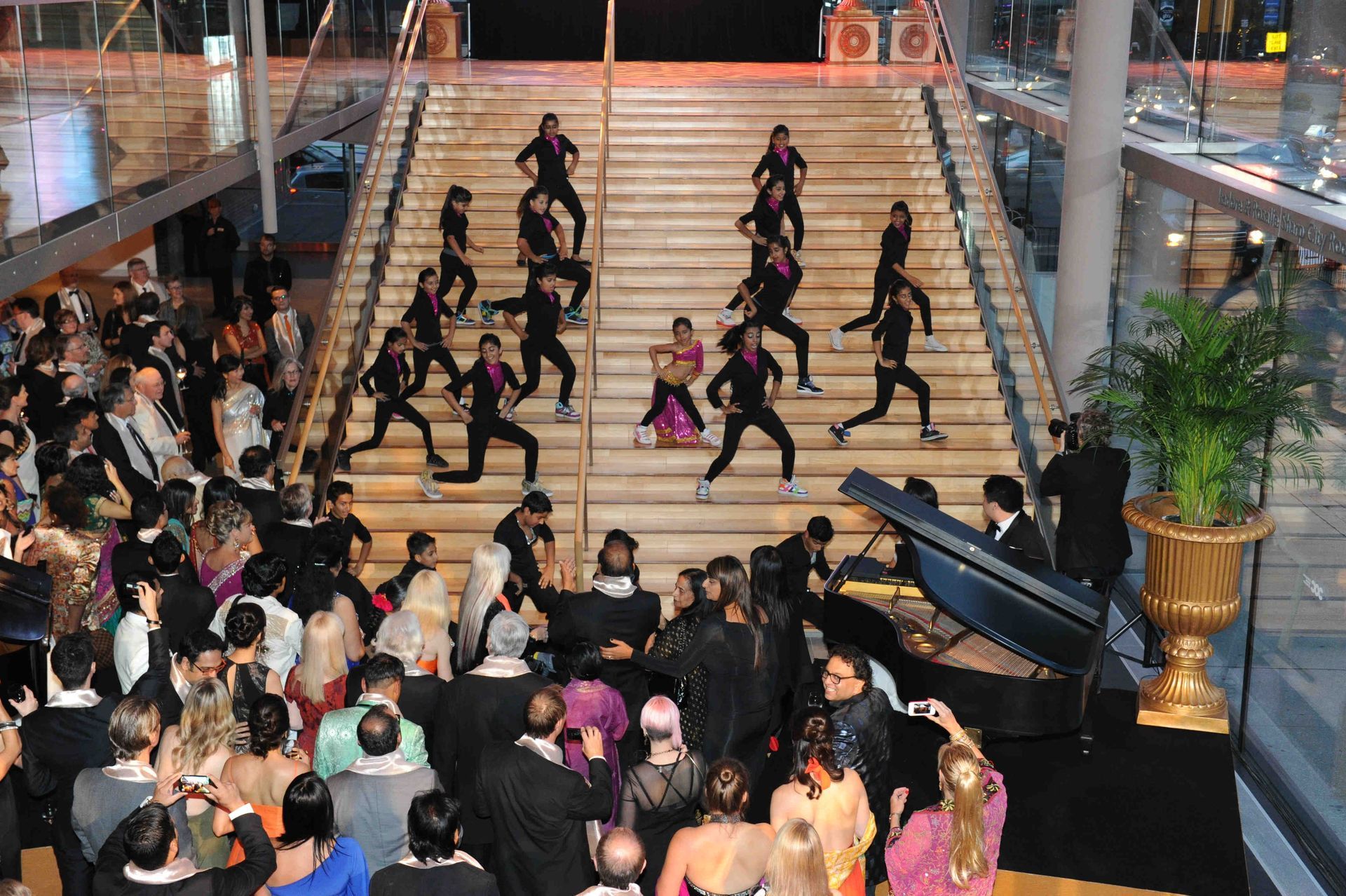 A group of people are dancing on a set of stairs