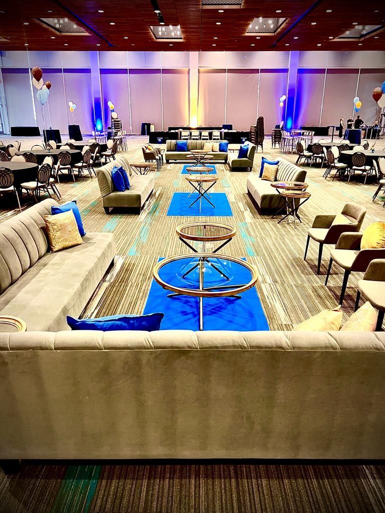 A large room filled with furniture and tables.