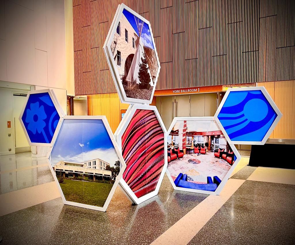 A collage of pictures on a table with a building in the background