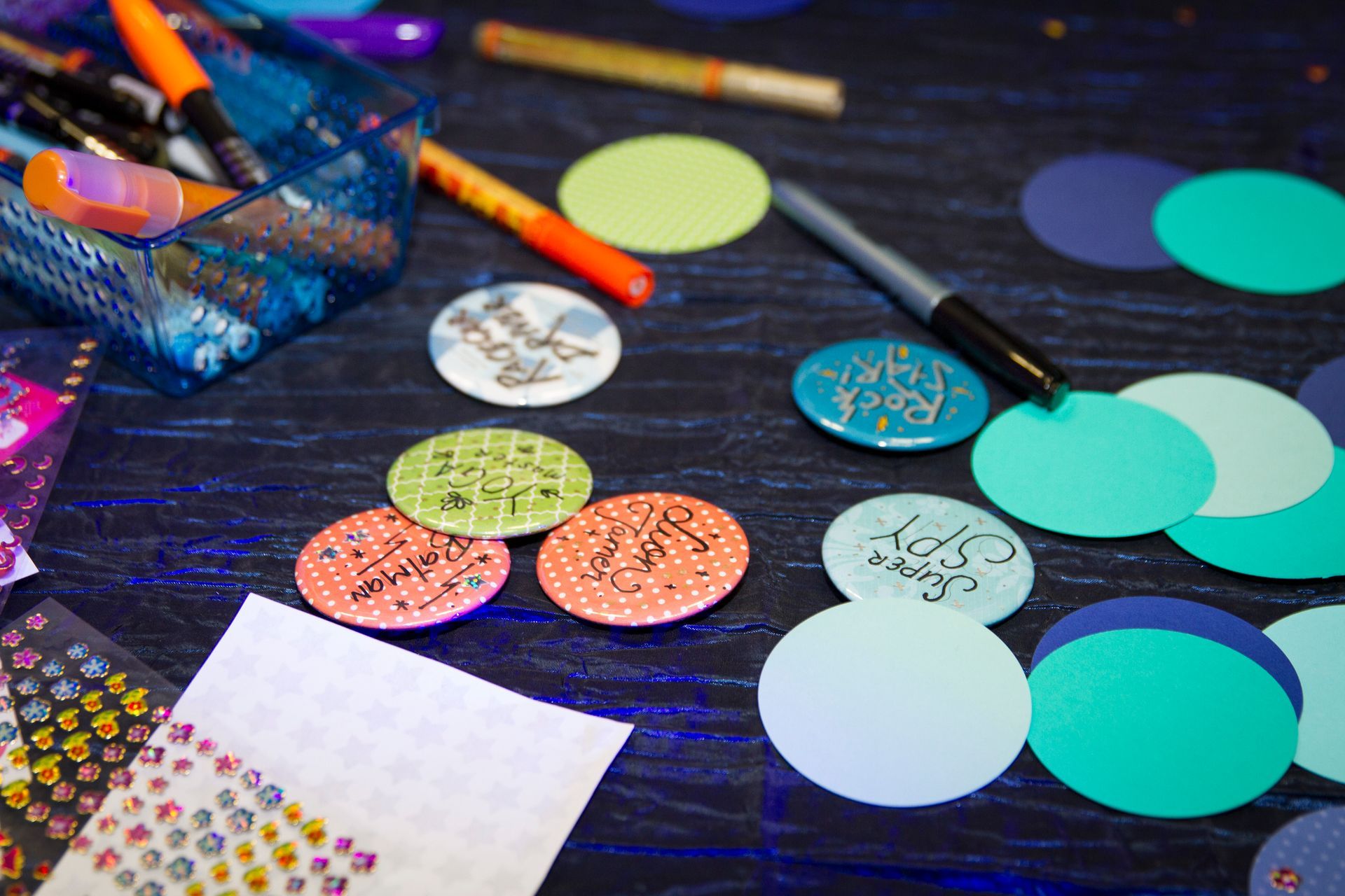 A bunch of circles and stickers on a table
