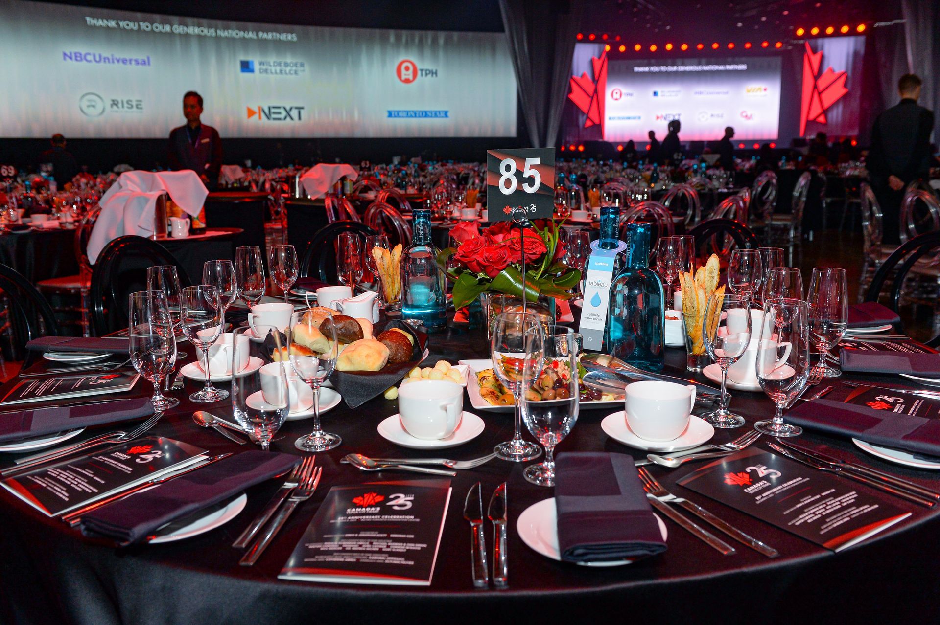 A table set for a banquet with a number 85 on it