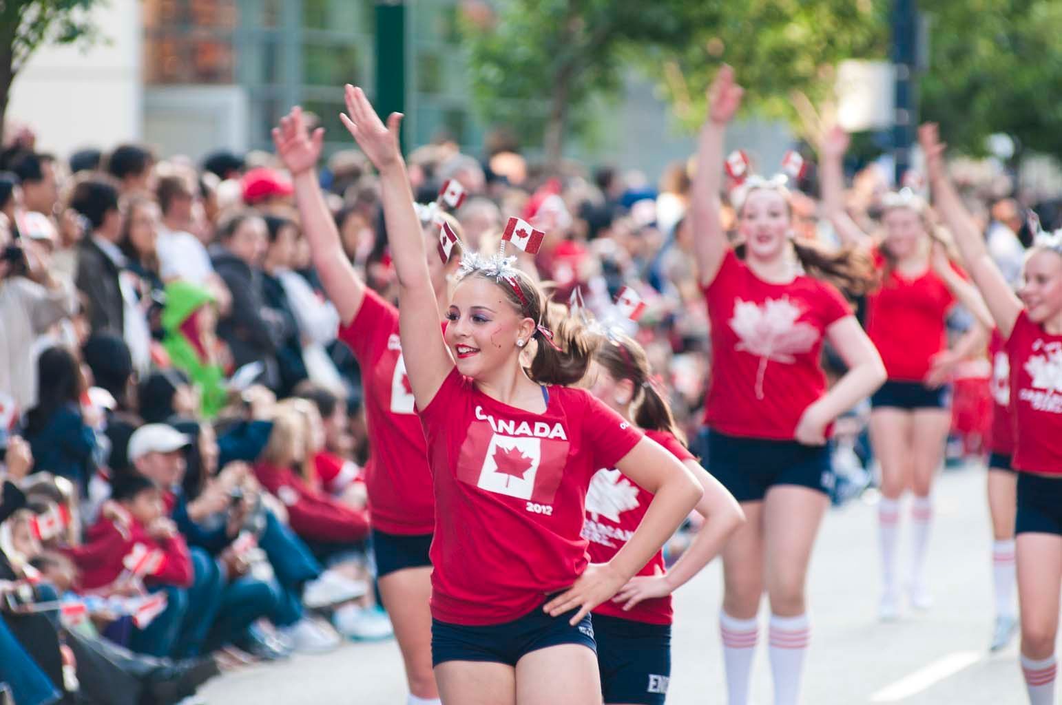 A man in a red suit is giving a speech at the junior opening night awards