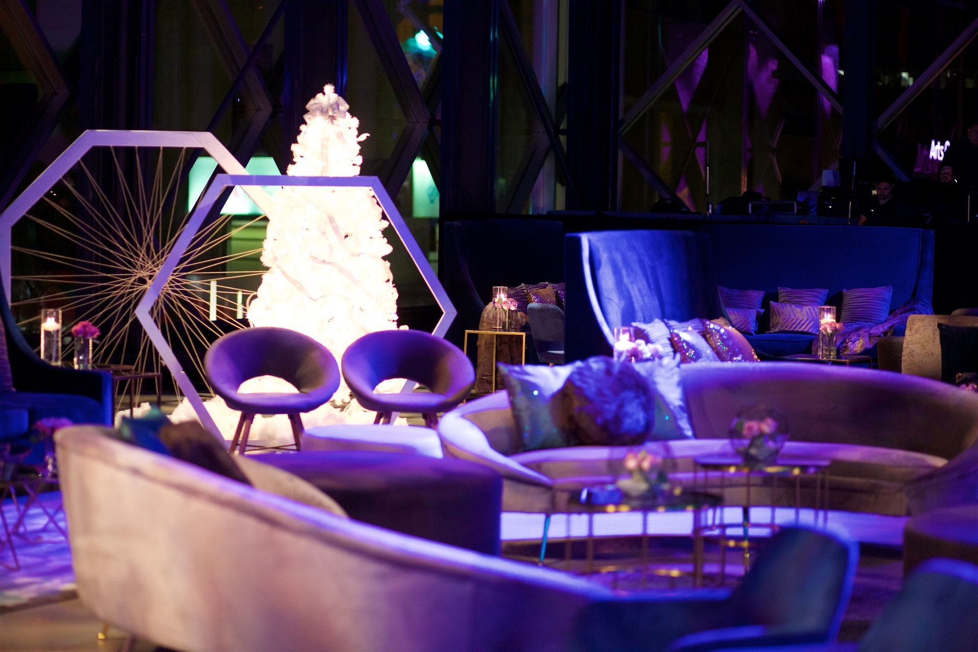 A living room filled with furniture and a christmas tree.