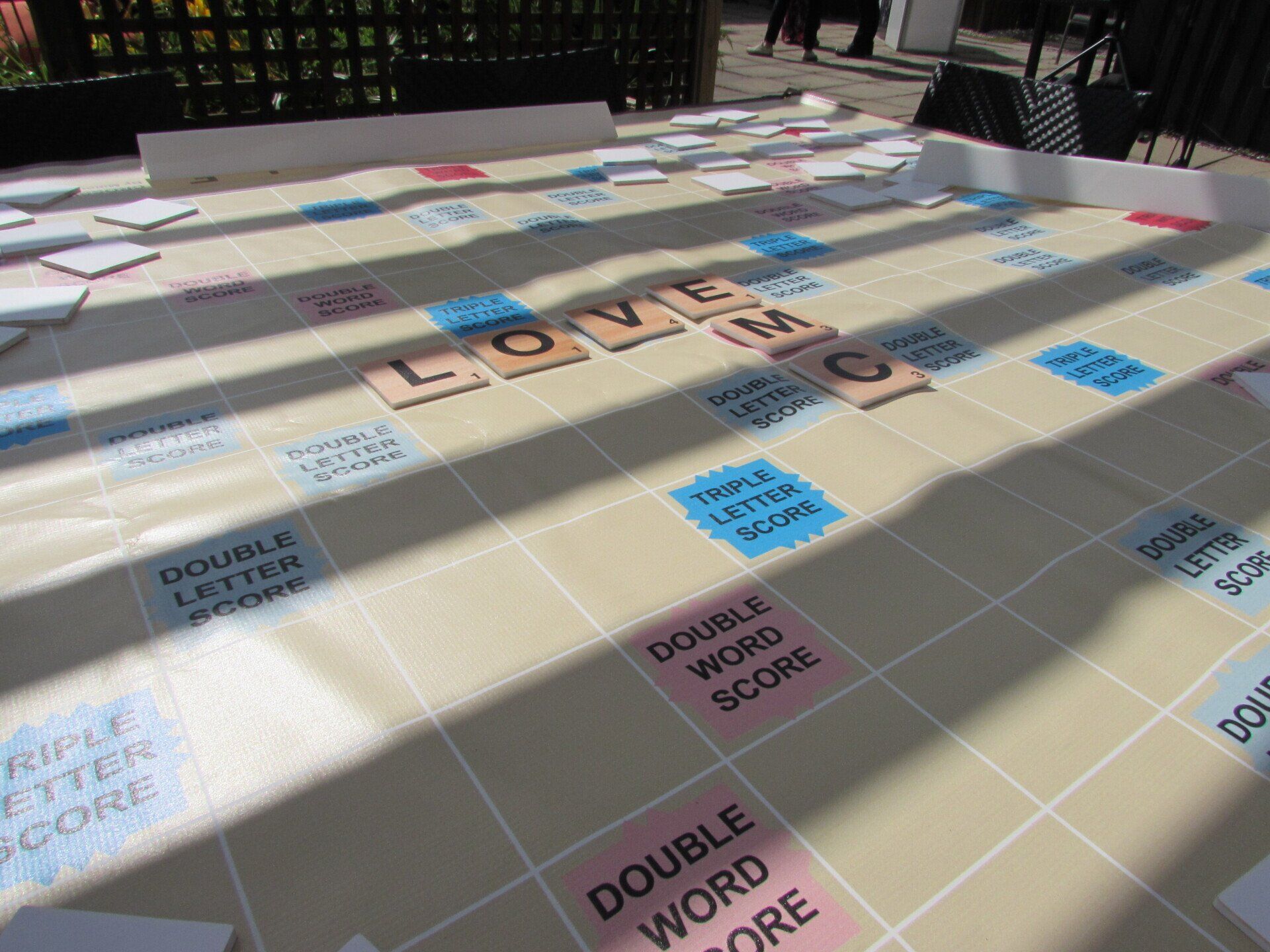 A scrabble board with the word love on it