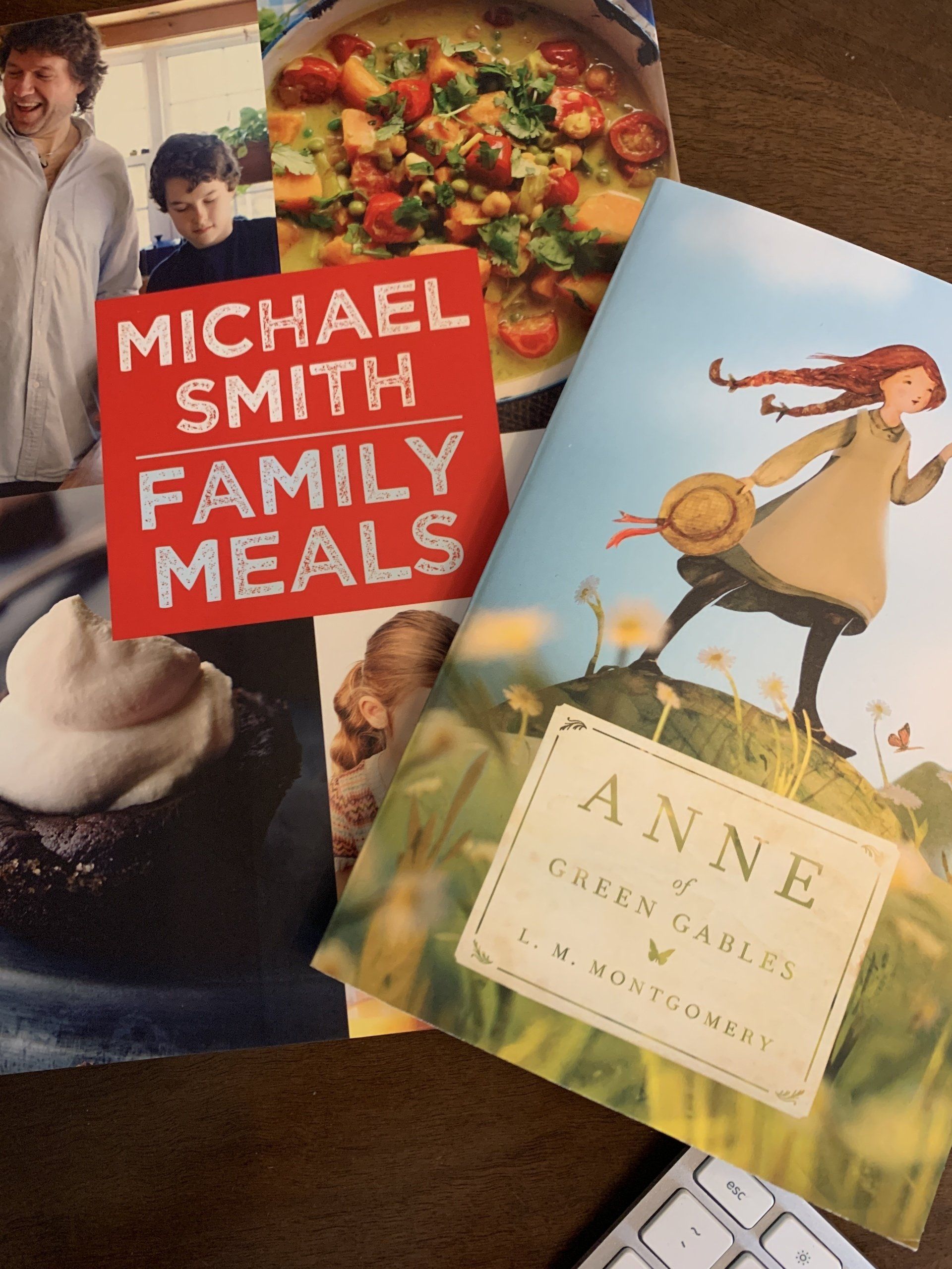 A stack of books including one by michael smith