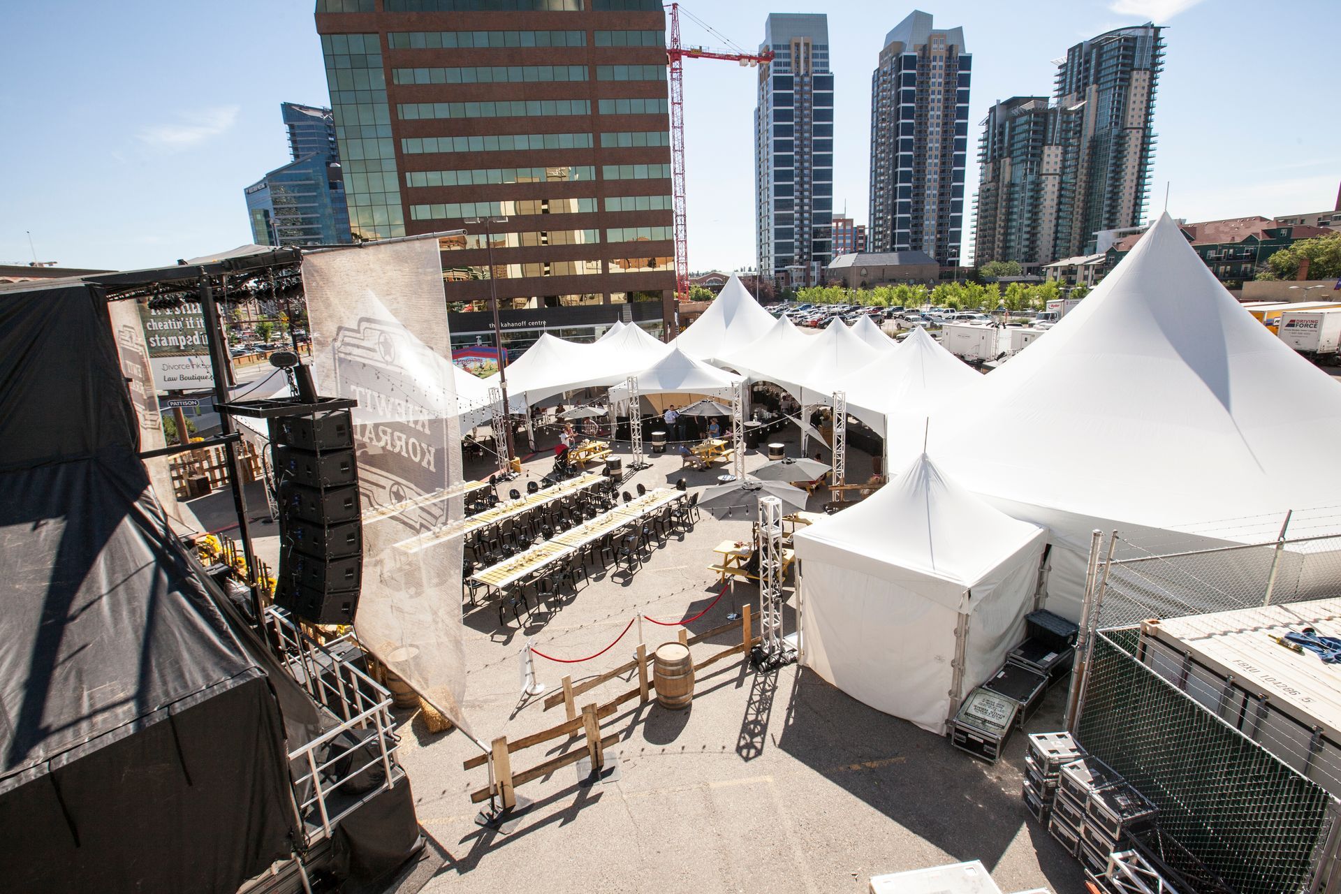 An aerial view of a large area with lots of tents and tables