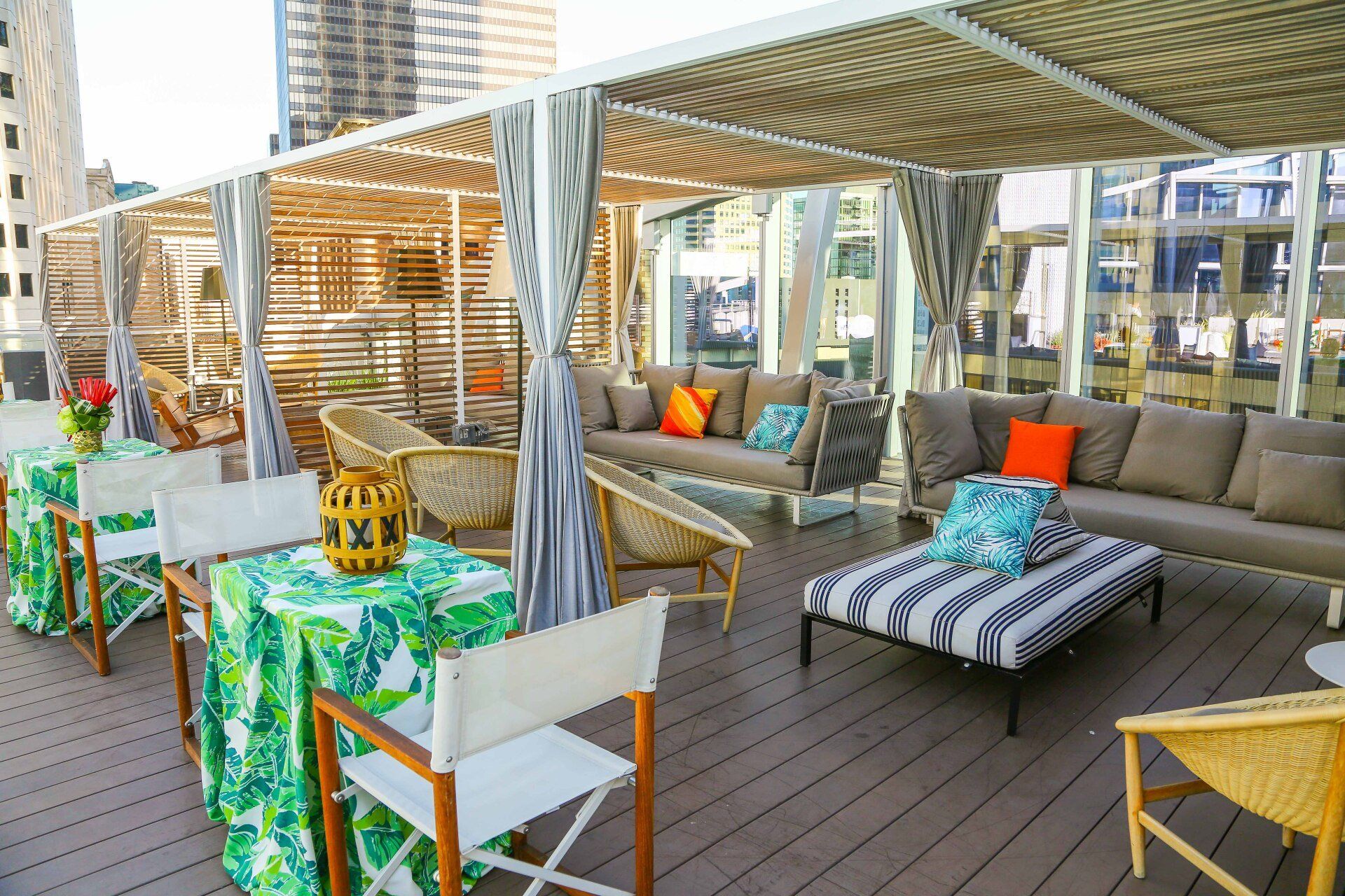 There are many chairs and tables on the deck.