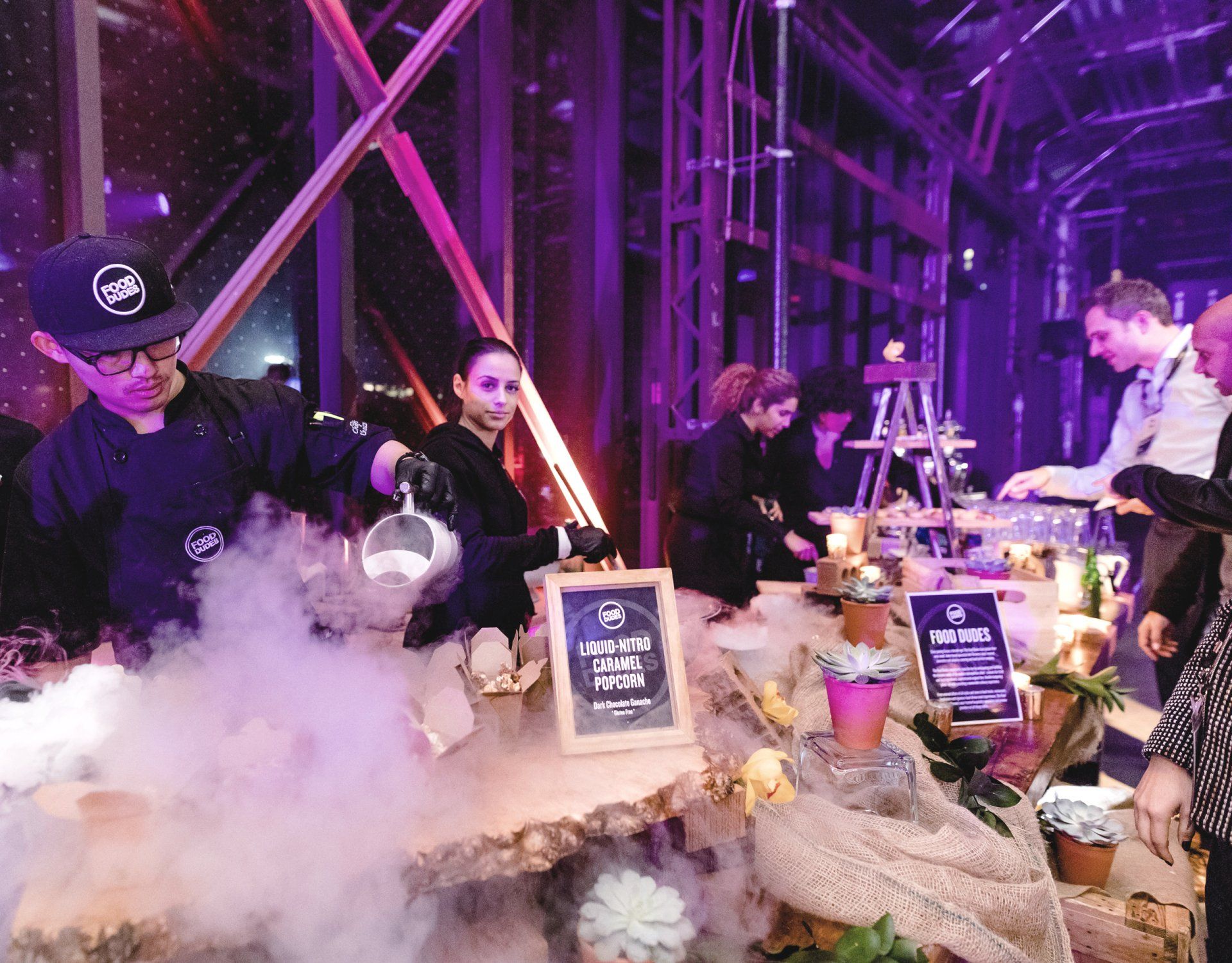 A man is pouring liquid nitrogen into a container at a party