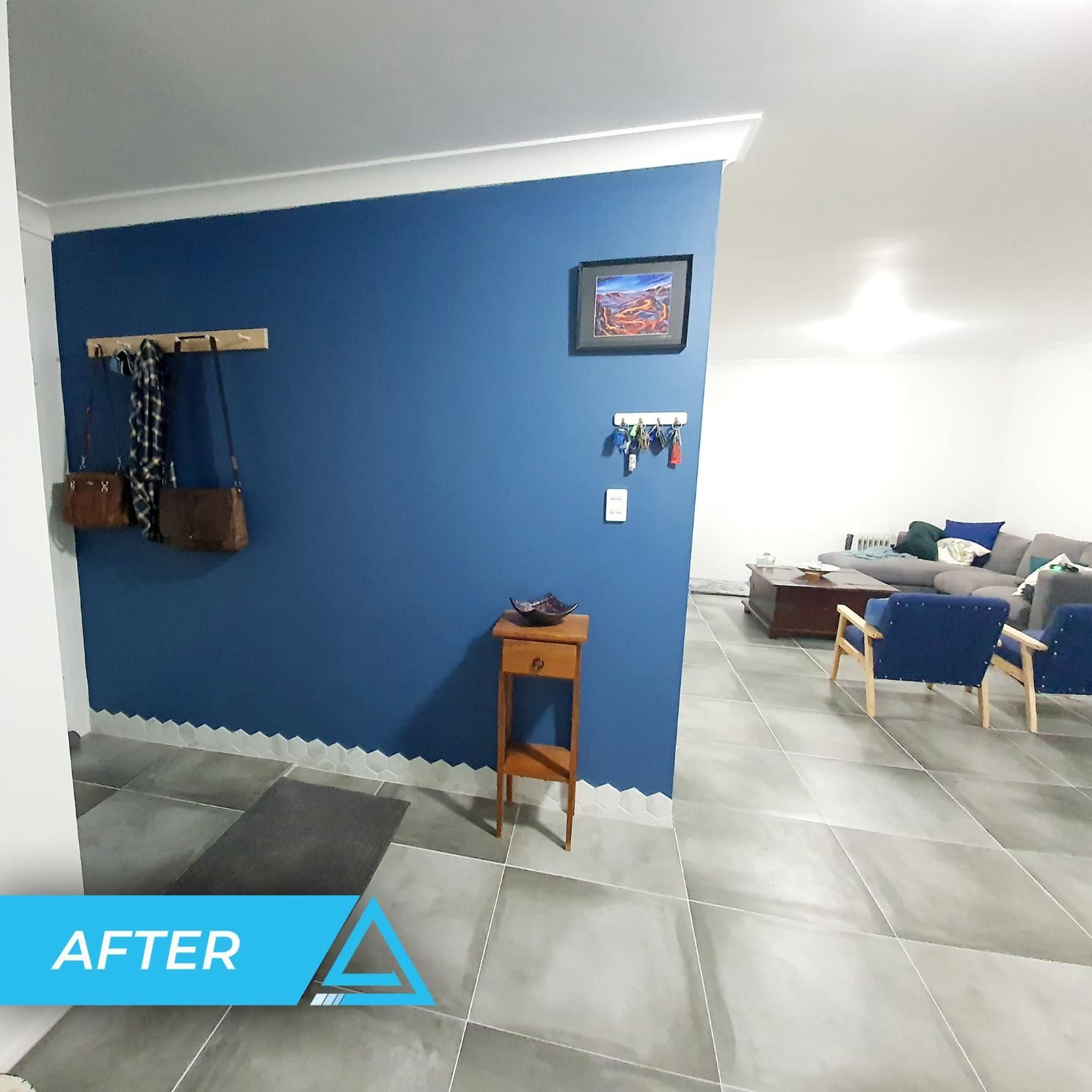 A Picture Of A Living Room With A Blue Wall And The Words After — APEX Painting & Maintenance In Shellharbour, NSW