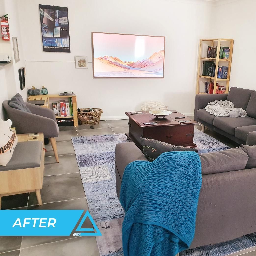A Living Room With A Blue Blanket On The Couch — APEX Painting & Maintenance In Flinders, NSW
