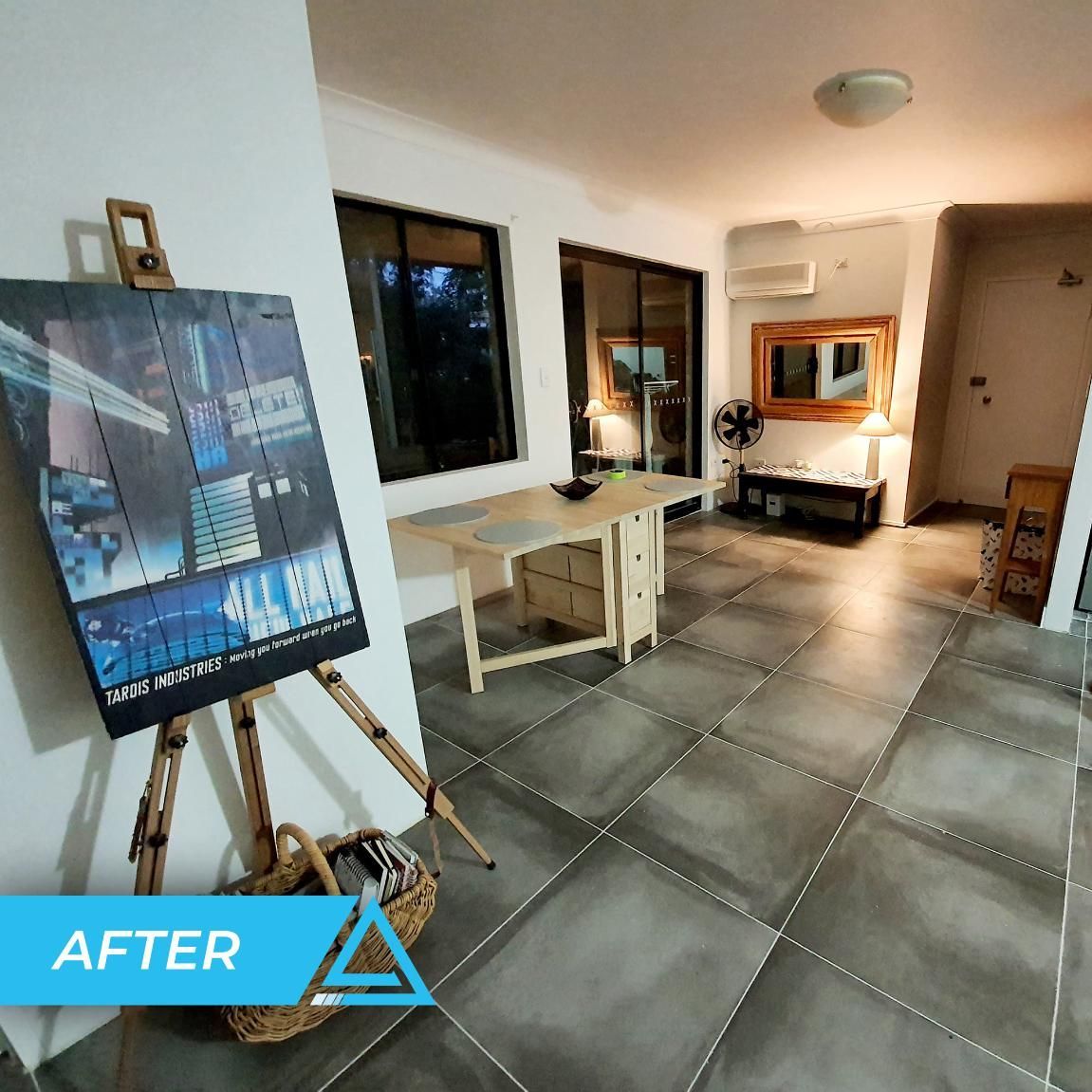 A Room With A Painting On An Easel — APEX Painting & Maintenance In Corrimal, NSW