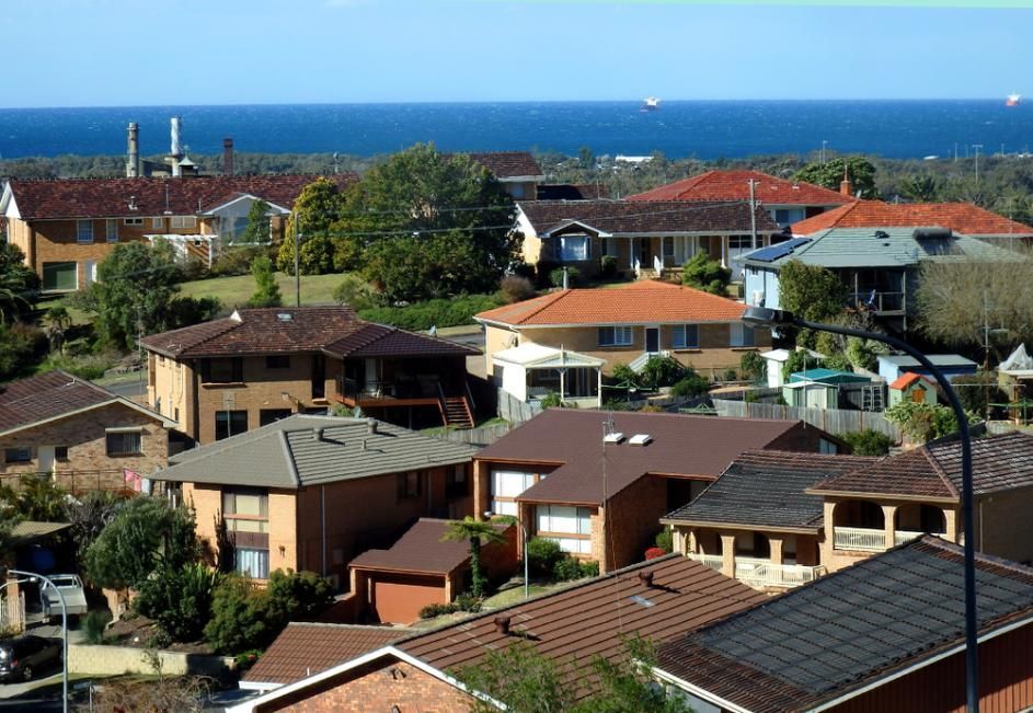 An Aerial View Of A Residential Area With The Ocean In The Background — APEX Painting & Maintenance In Corrimal, NSW