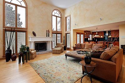 A living room filled with furniture and a fireplace