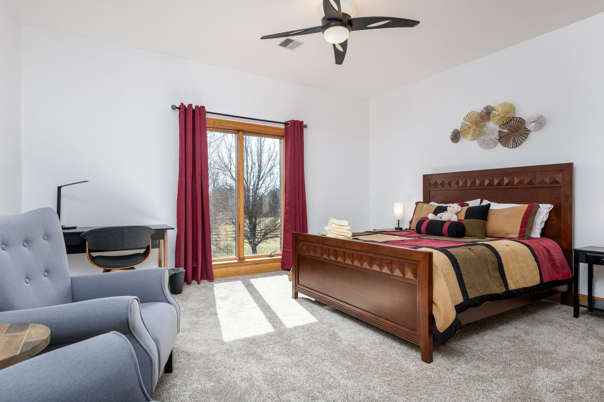 A bedroom with a large bed , chair , desk and window at Chestnuthill Countryside Manor