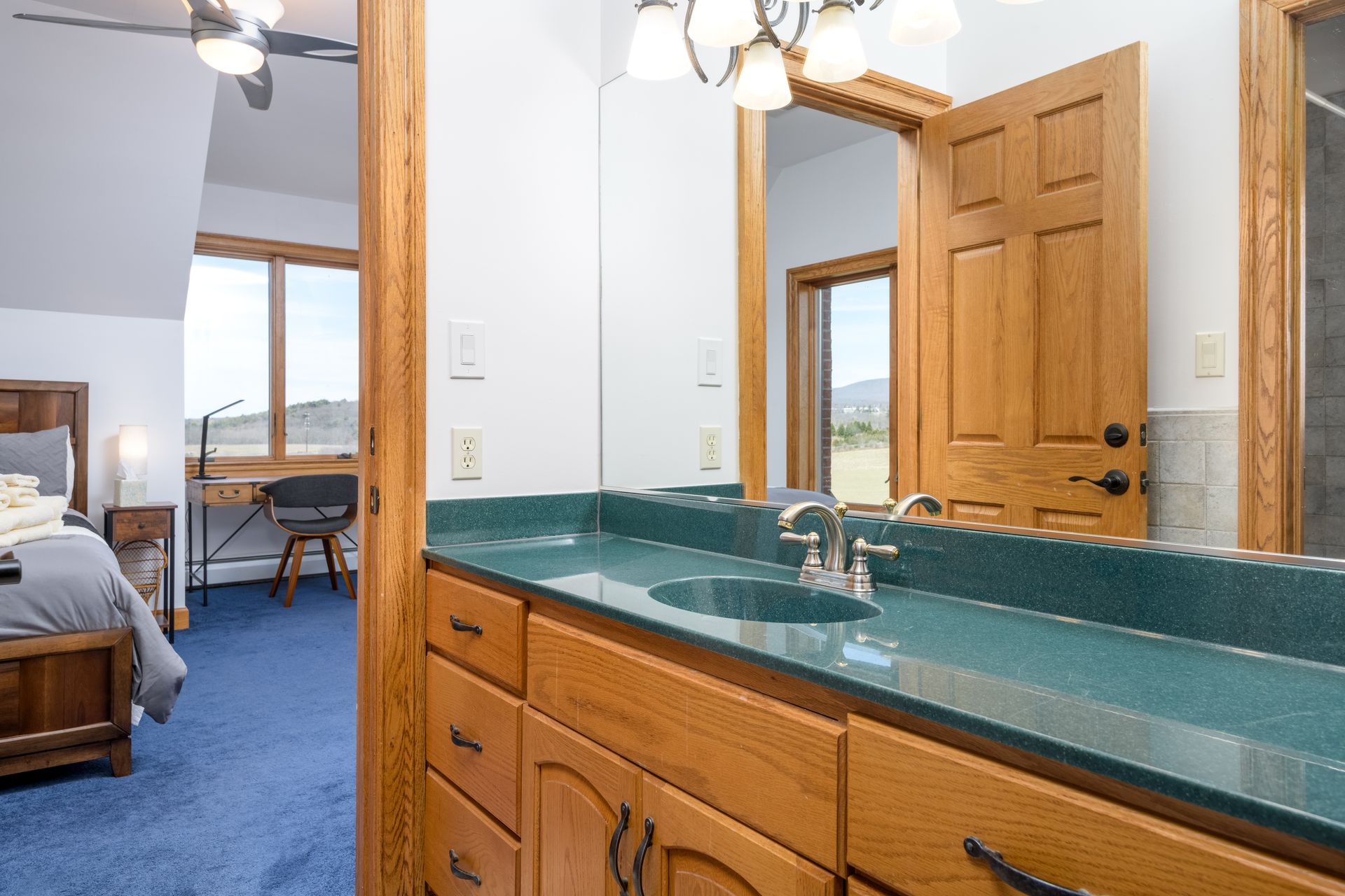 A bathroom with a double sink and a large mirror at Chestnuthill Countryside Manor