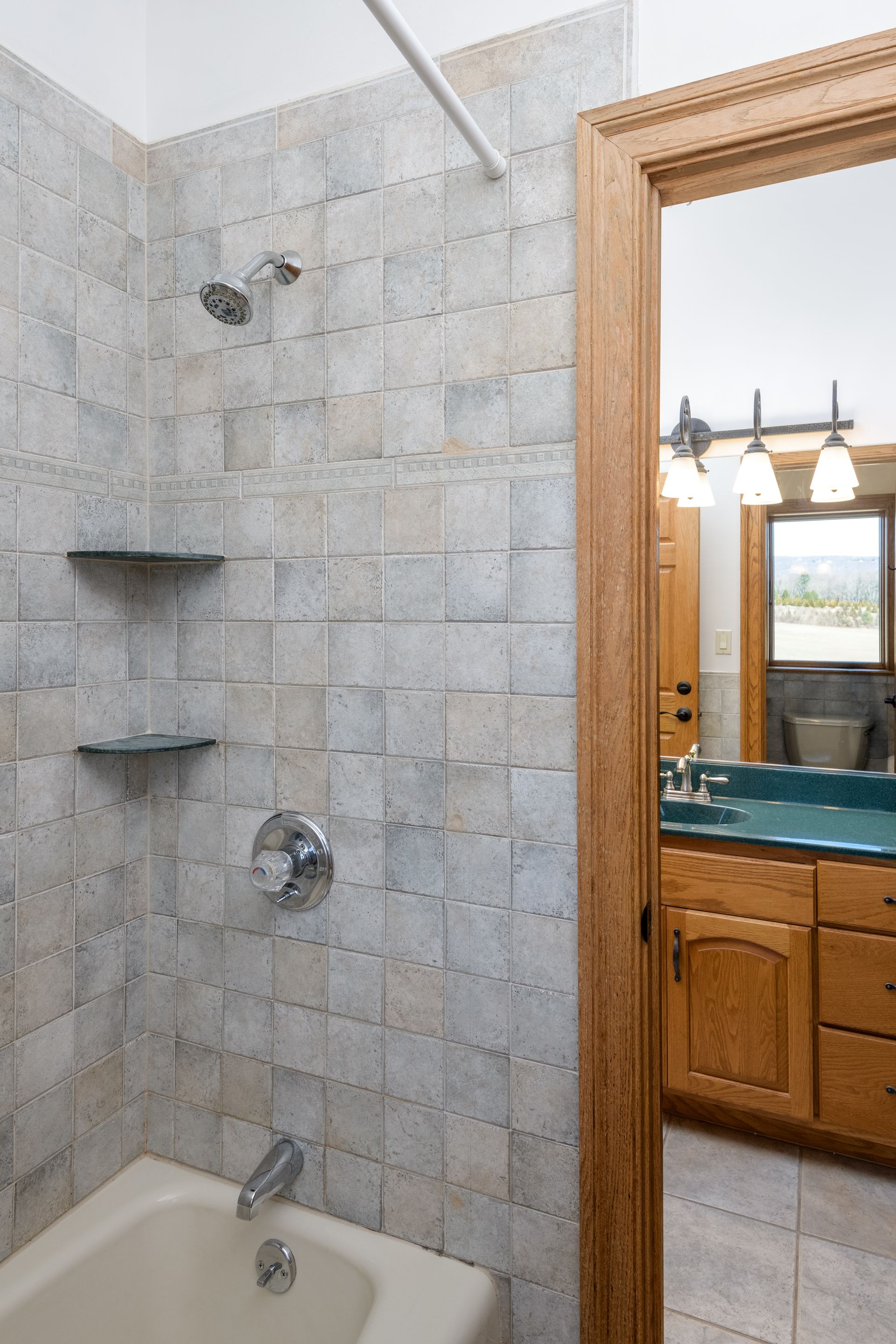 A bathroom with a tub , sink and shower at Chestnuthill Countryside Manor