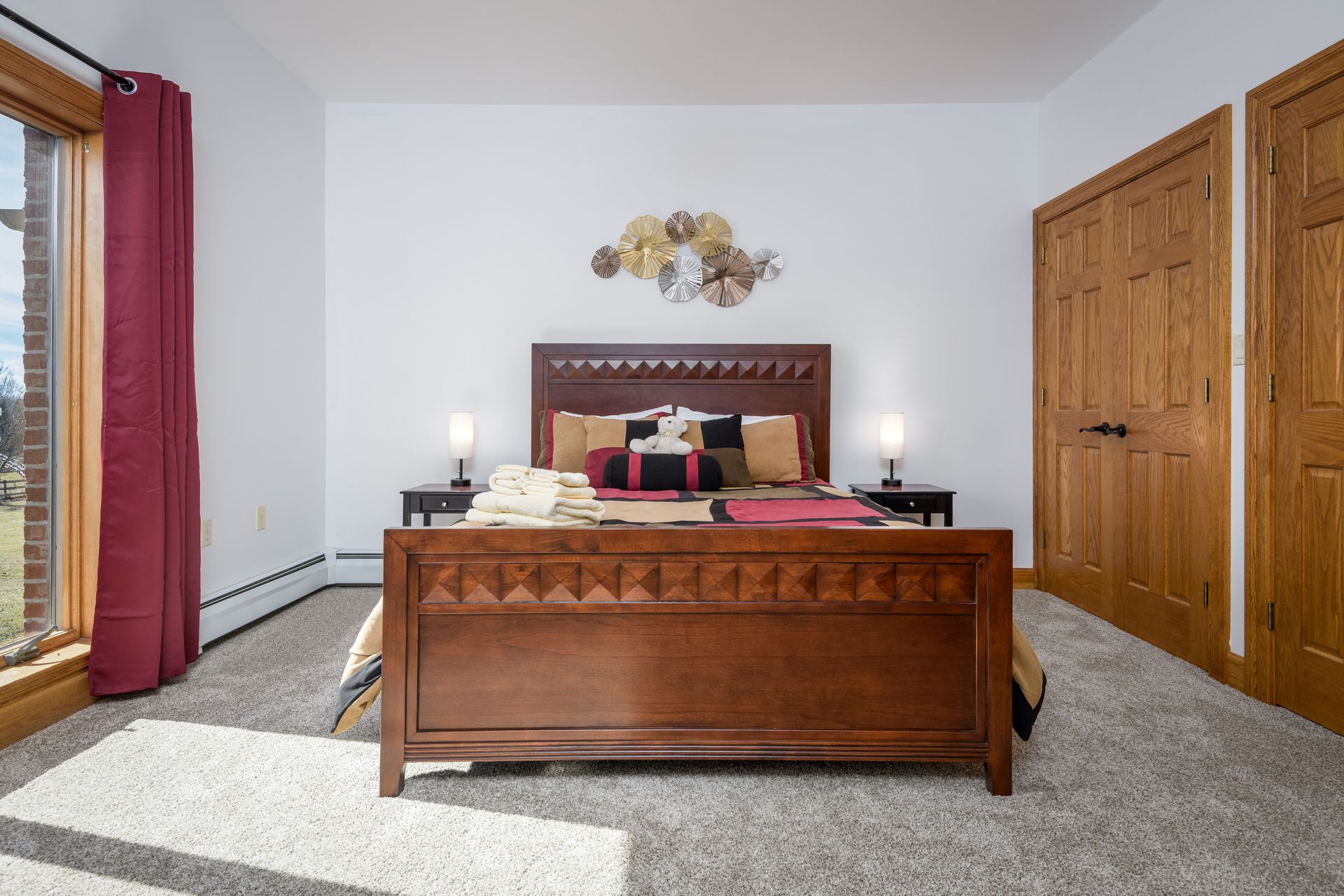 A bedroom with a large wooden bed and a large window at Chestnuthill Countryside Manor