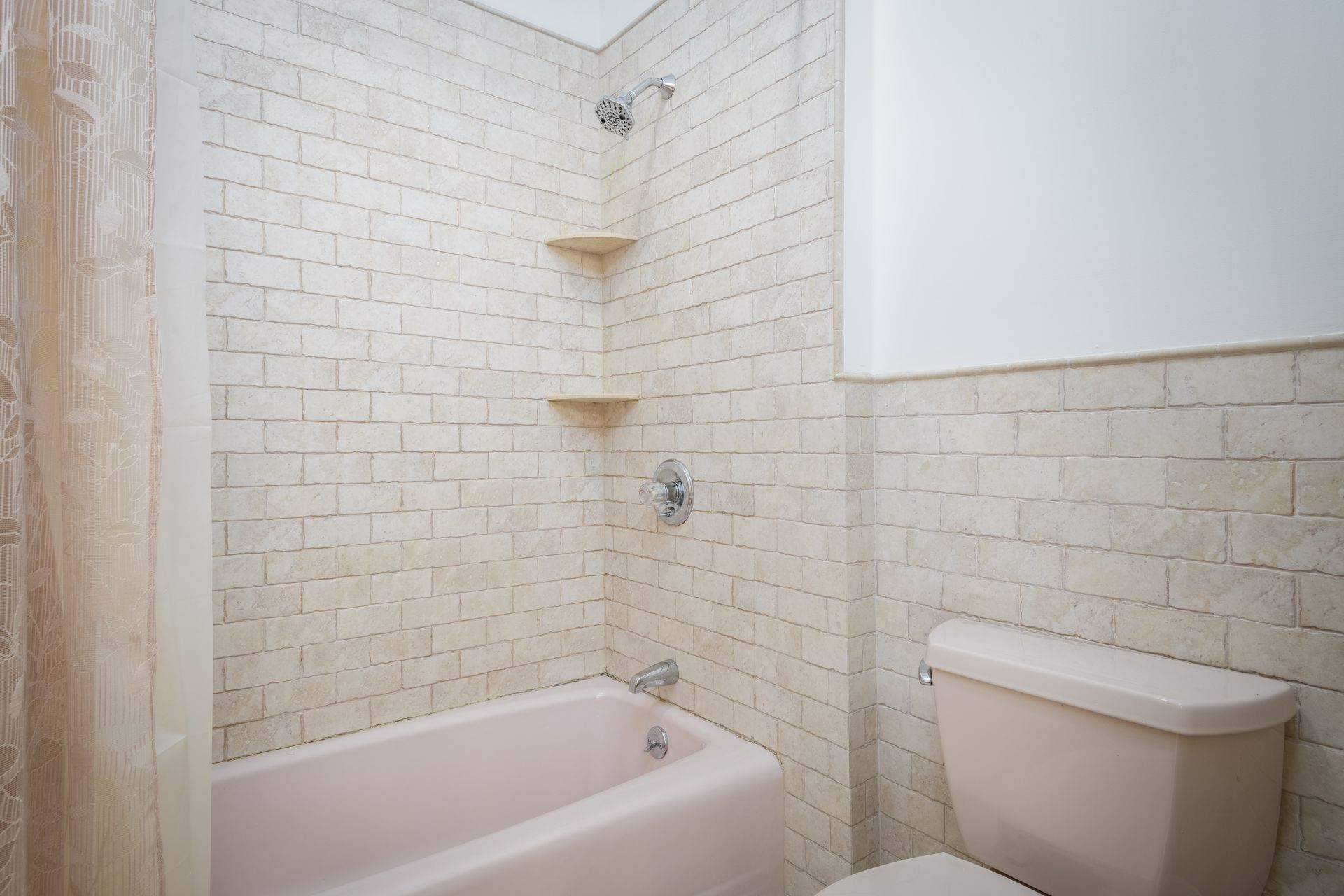A bathroom with a bathtub , toilet and shower at Chestnuthill Countryside Manor