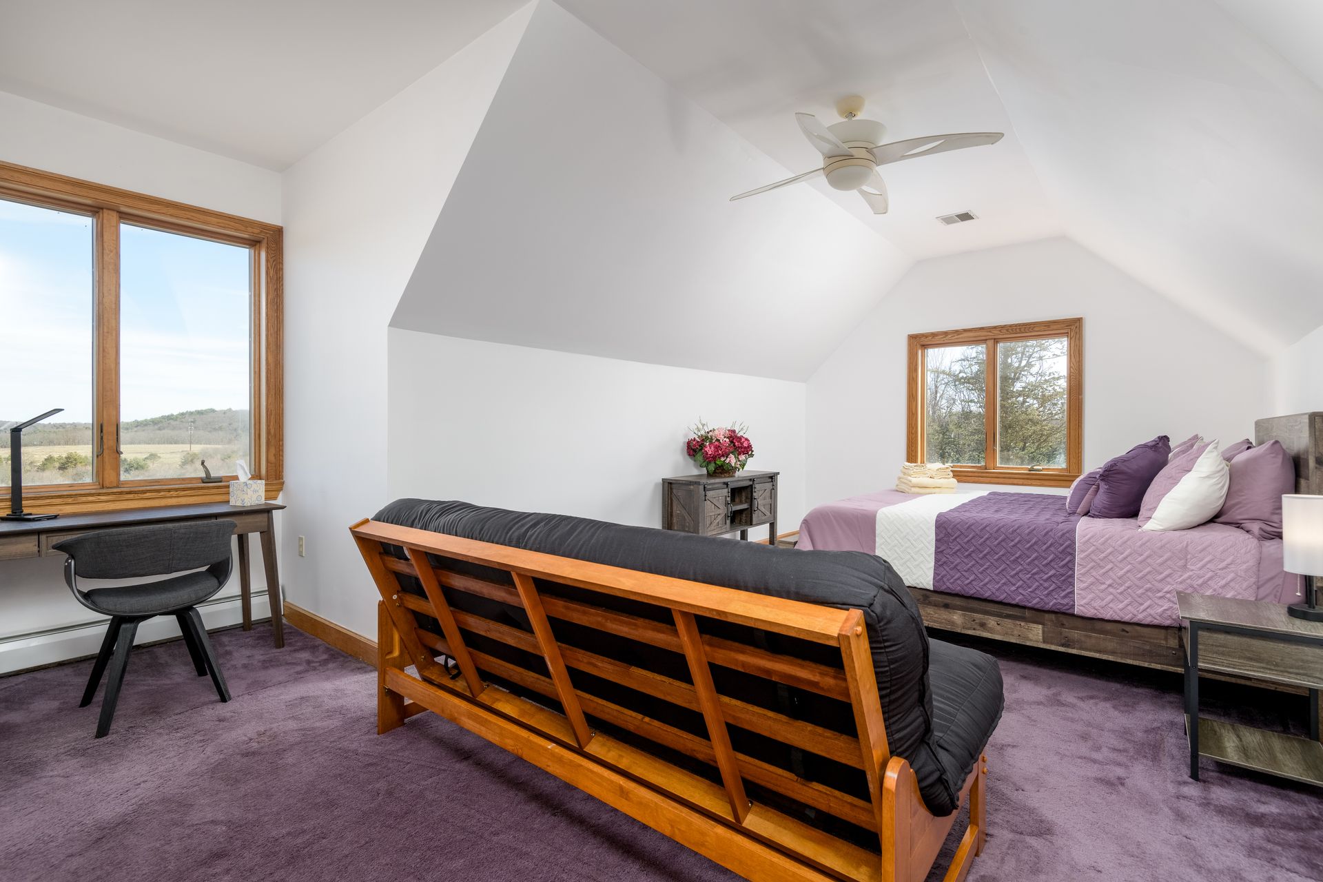 A bedroom with a couch , bed , desk and ceiling fan at Chestnuthill Countryside Manor