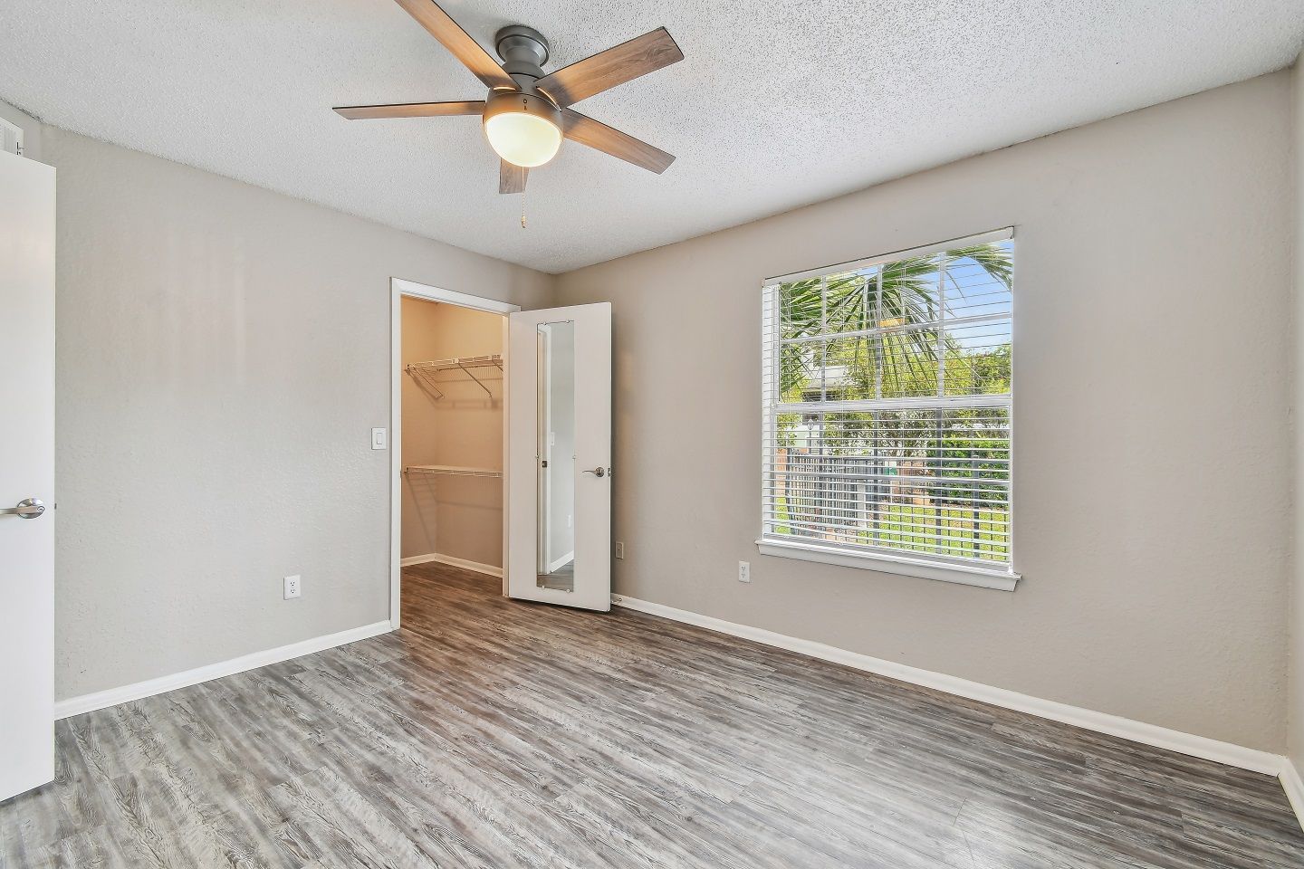Spacious Bedroom with Ceiling Fan at The Glades in Altamonte Springs, FL.