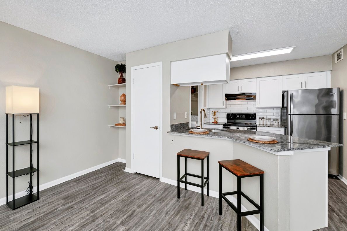 Apartments and town homes with modern kitchen with stainless steel appliances at The Glades in Altamonte Springs, FL.